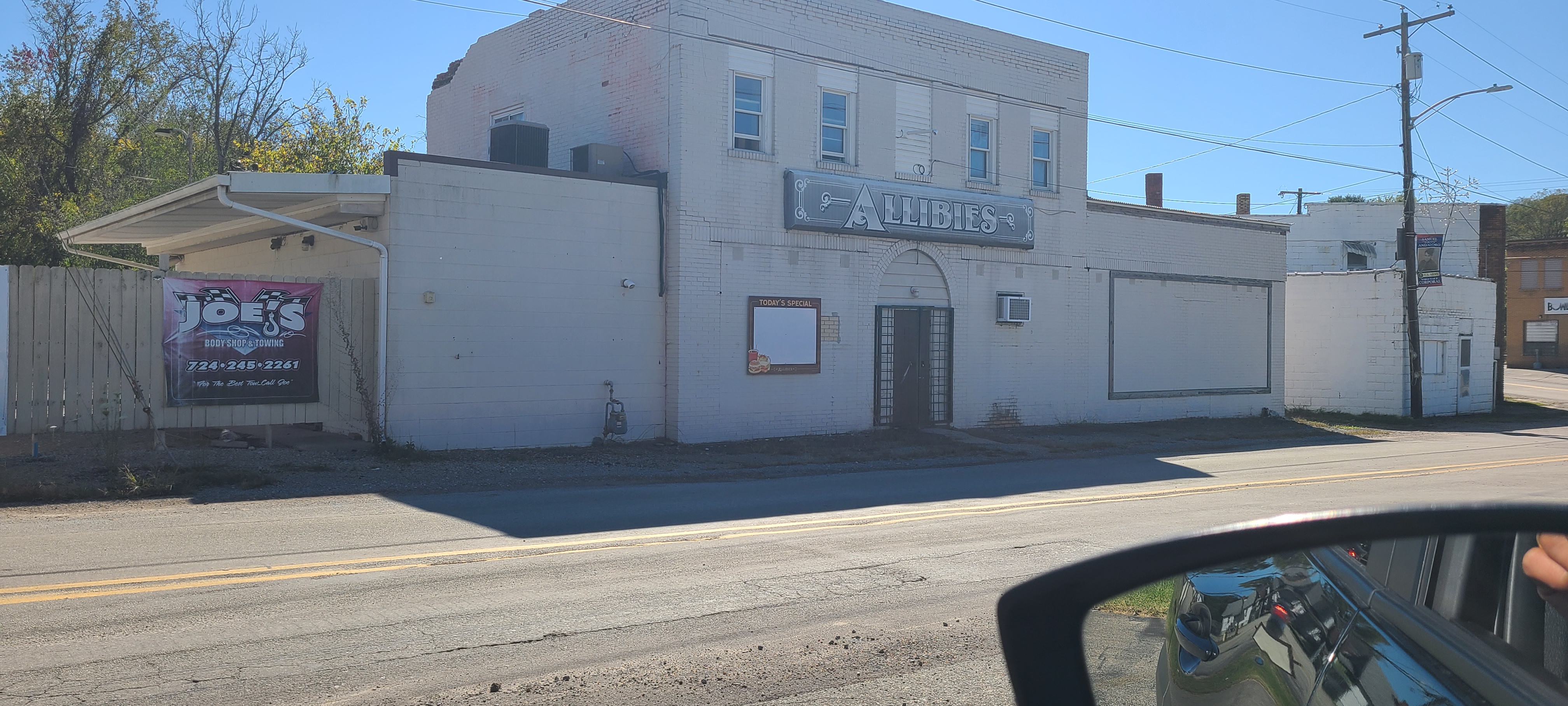 (EST. 700K) 2 story commercial building with a famous bar and an upstairs 2 bedroom apartment