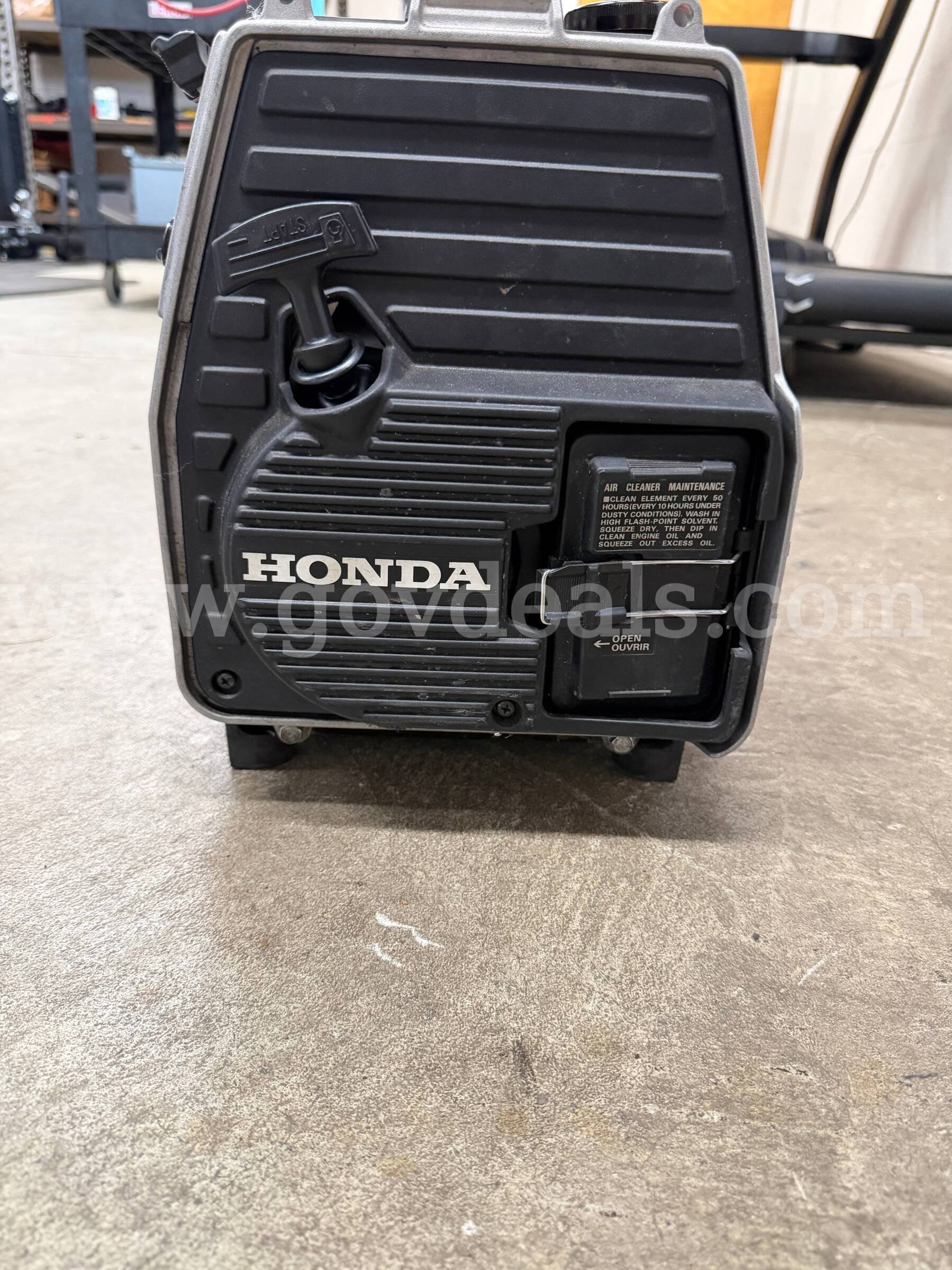 Portable gas generator with attached light Honda EM650 Government Surplus Auction - Photo #2