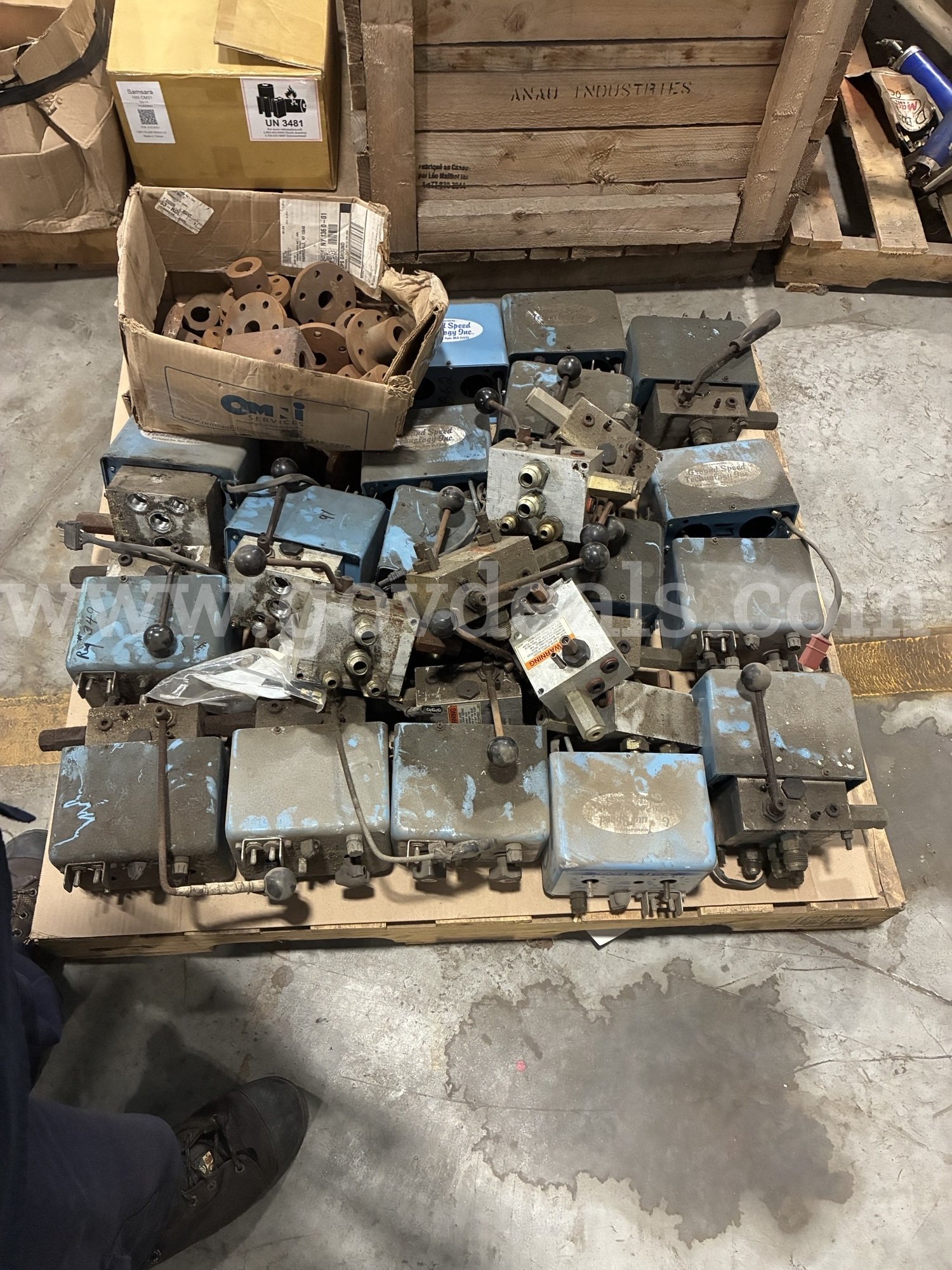 Pallet of sander control valves and assorted PTO hub flanges   Government Surplus Auction - Primary Photo