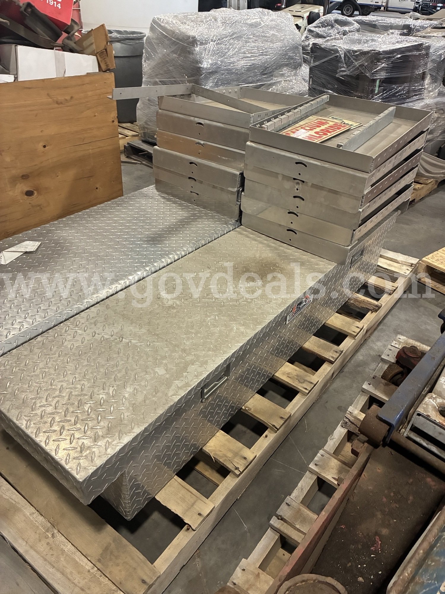 Pallet of truck tool boxes   Government Surplus Auction - Primary Photo