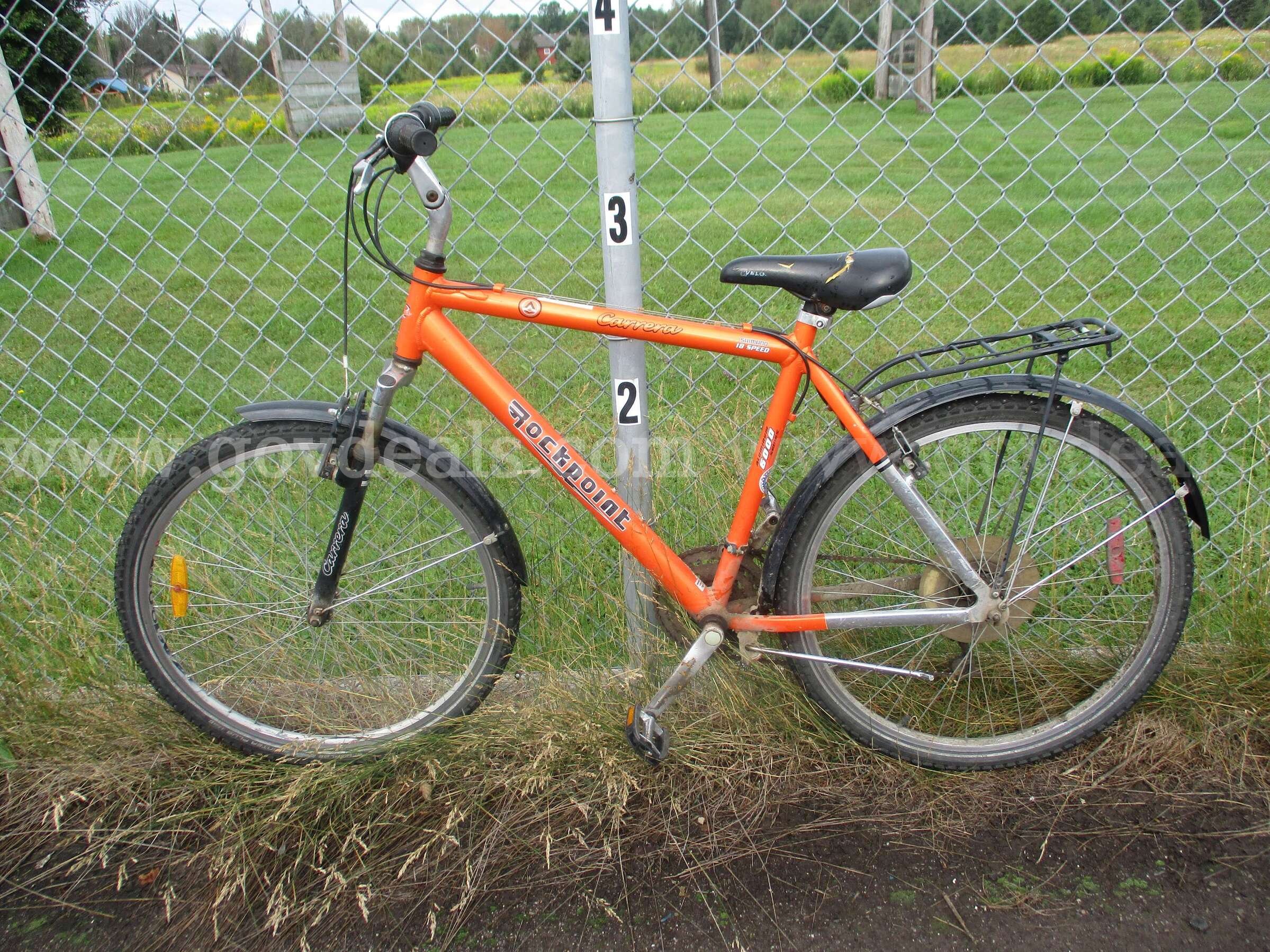 Mountain bike - orange, 18 speed, kickstand