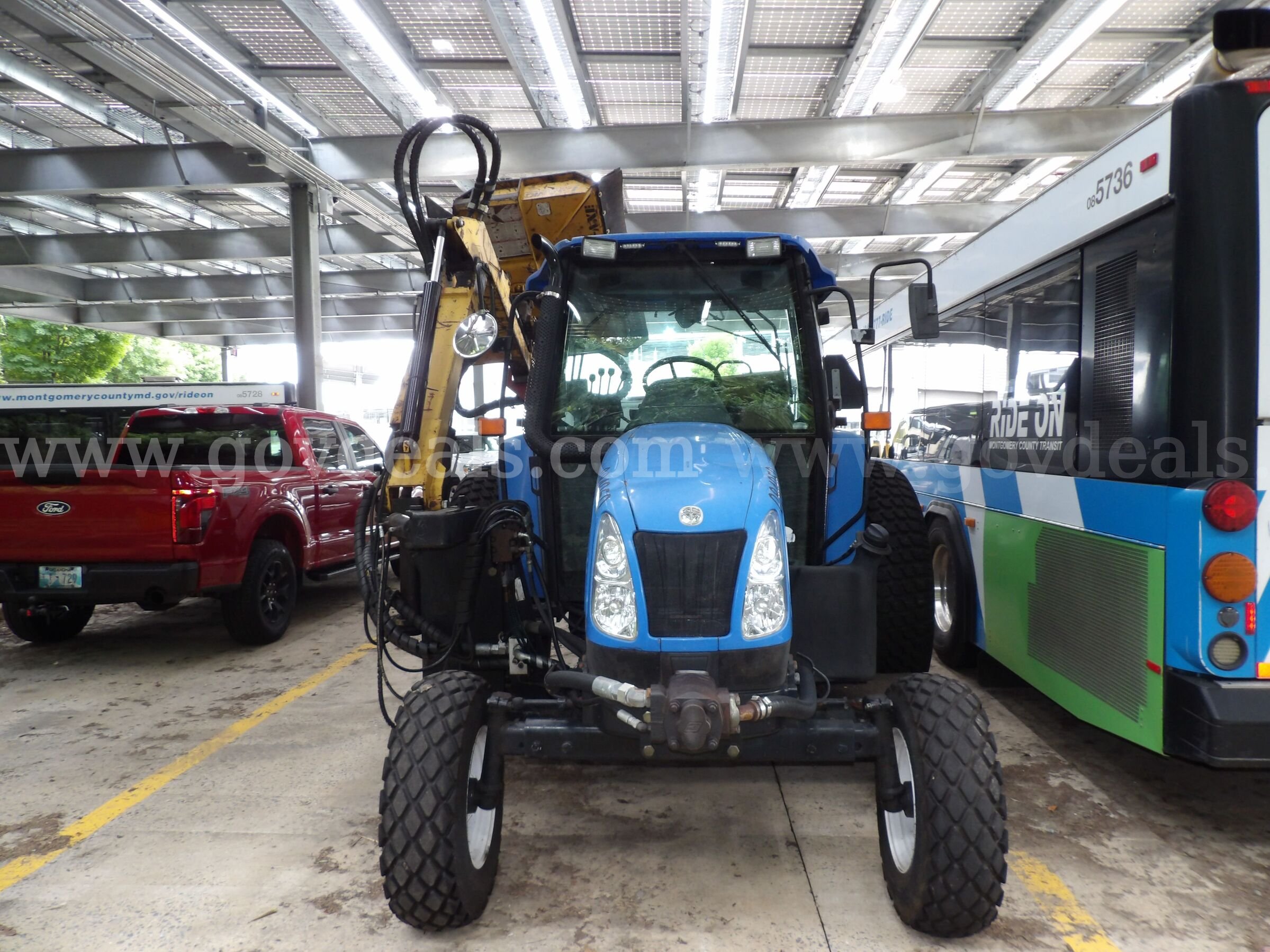 New Holland TL80A Tractor with Boom Mower New Holland  Government Surplus Auction - Photo #2
