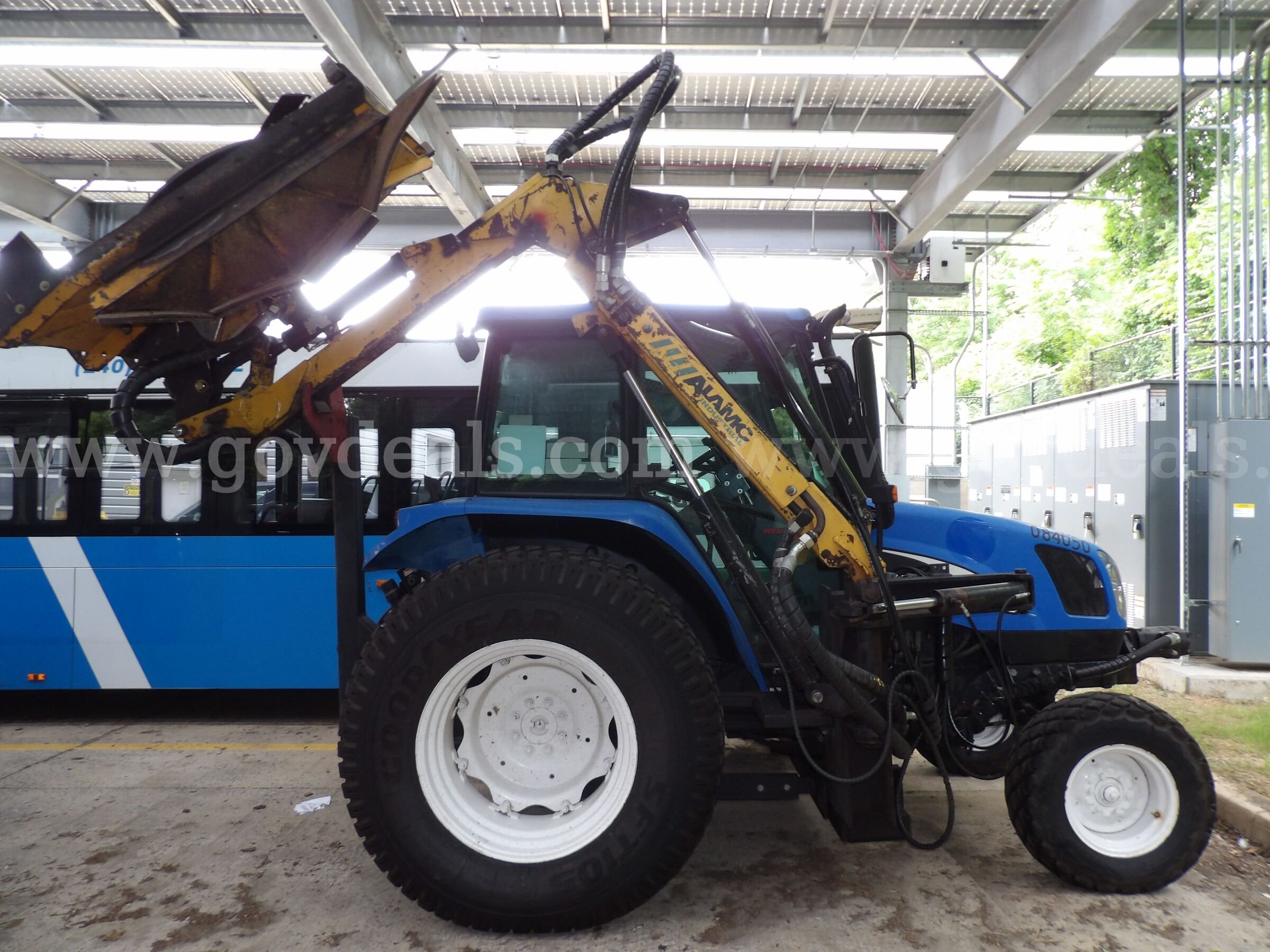 New Holland TL80A Tractor with Boom Mower New Holland  Government Surplus Auction - Photo #3