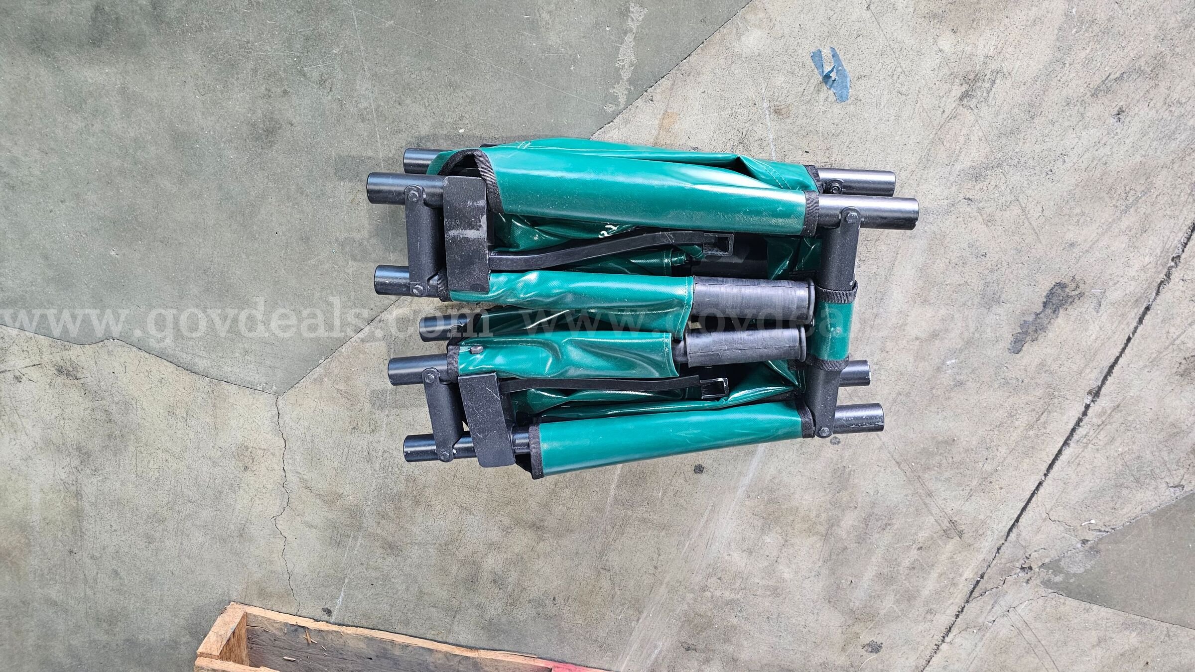 pallet of approximately 25 green folding Military style field stretchers.   Government Surplus Auction - Photo #2
