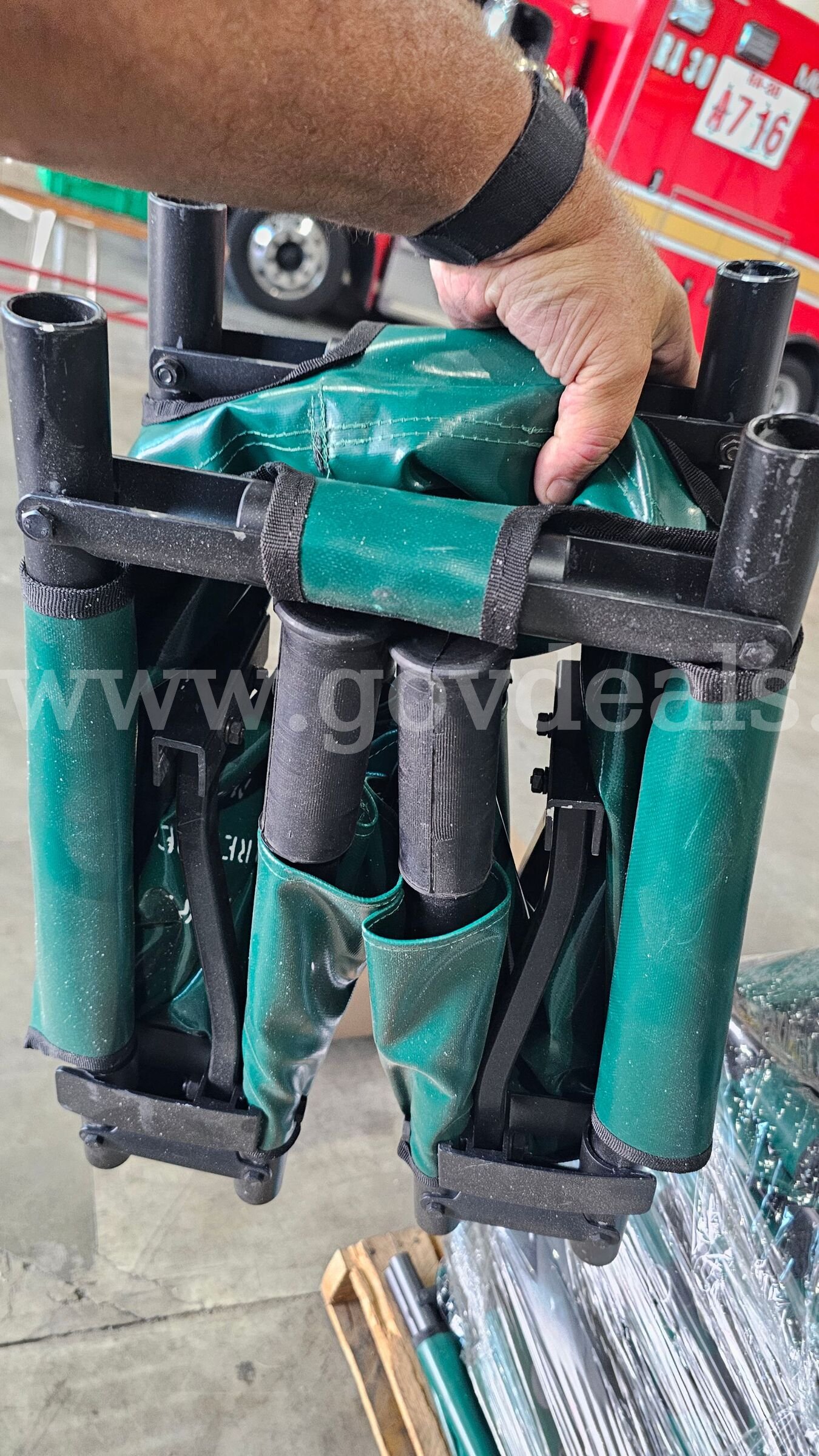 pallet of approximately 25 green folding Military style field stretchers.   Government Surplus Auction - Photo #3