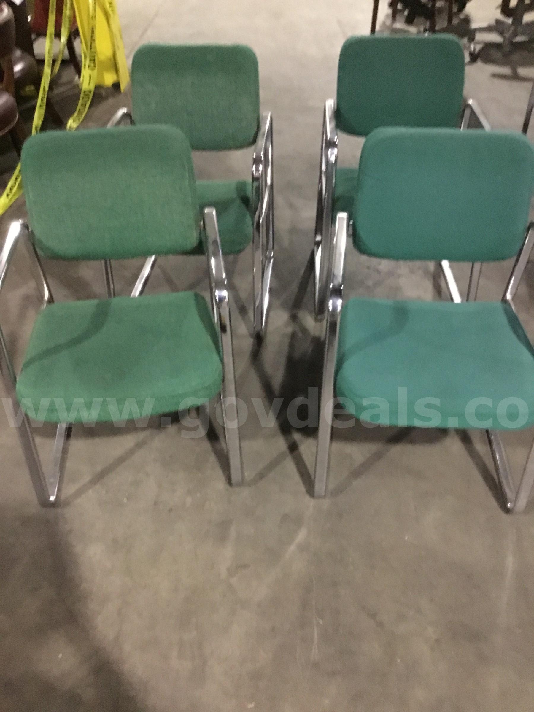4 green sled chairs; with chrome silver armrests  "DH"   Government Surplus Auction - Primary Photo
