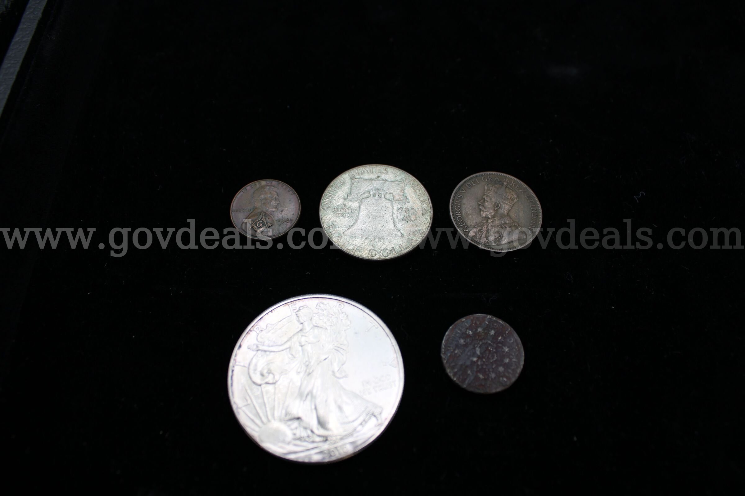 PENNY (1); FOREIGN (2); HALF DOLLAR (1); $1 COIN (1)   Government Surplus Auction - Primary Photo