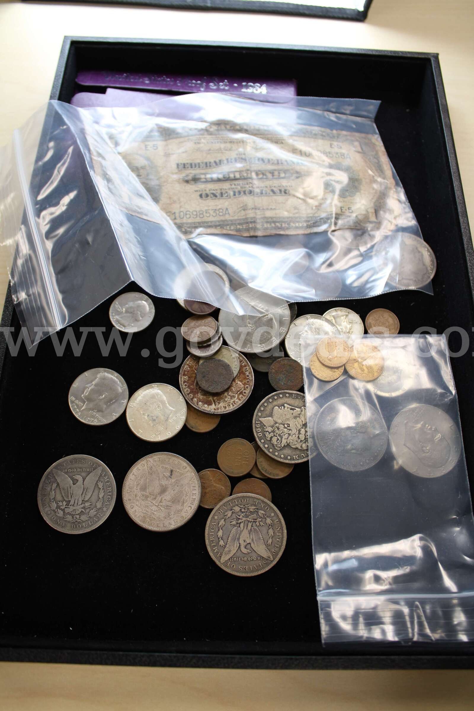 COIN SET (1); $1 BILL (1); $1 COIN (10); HALF DOLLARY (5); QUARTER (2)   Government Surplus Auction - Primary Photo