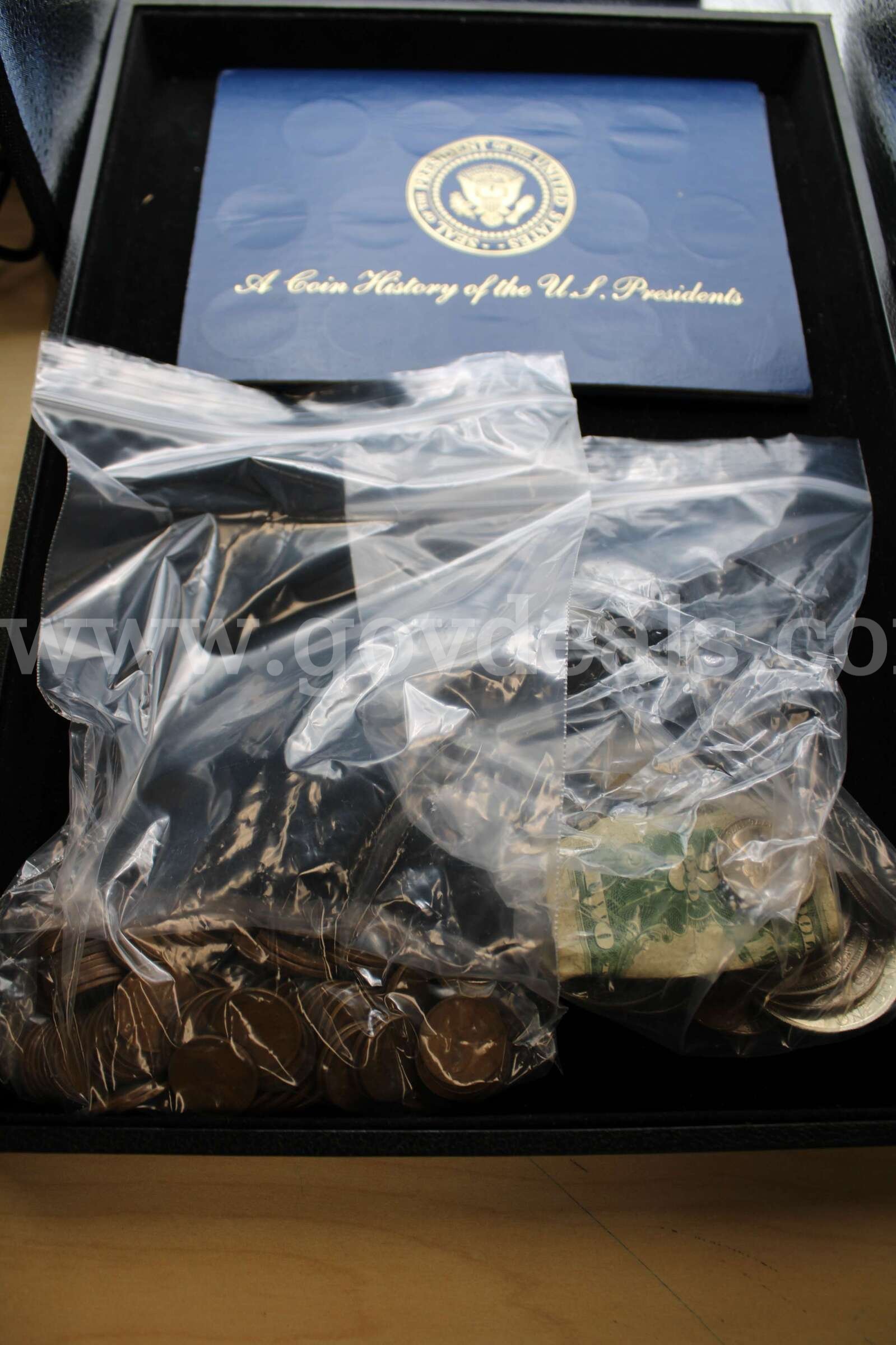 COIN SET (1); $2 BILL (1); $1 COIN (7); HALF DOLLAR (1); QUARTER (7); NICKEL (6)   Government Surplus Auction - Primary Photo