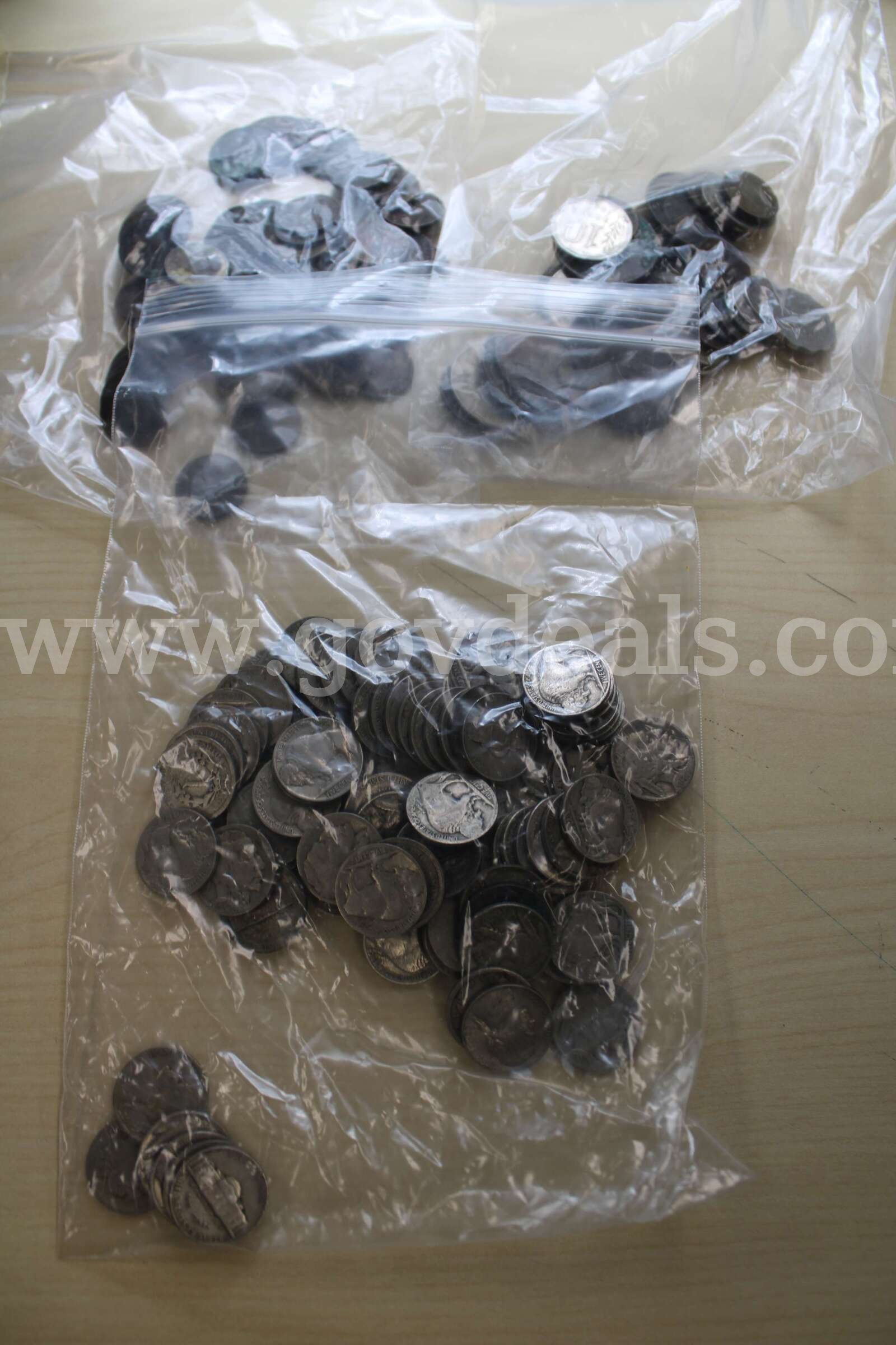 MISC COIN (4), FOREIGN COIN (39), 0.05 COIN (81), 0.01 COIN (75)   Government Surplus Auction - Primary Photo