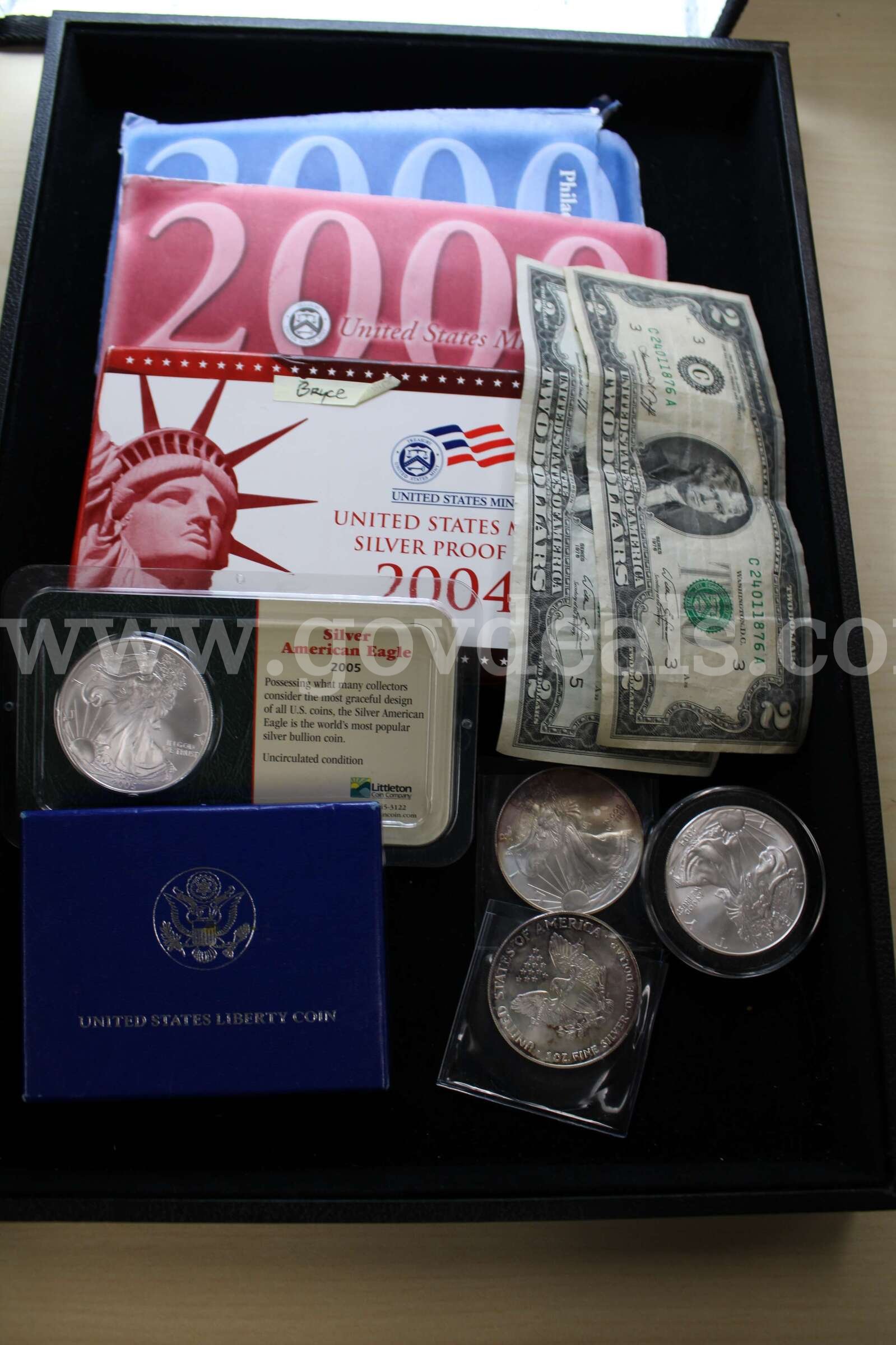 $2 BILL (2); $1 COIN (4); HALF DOLLAR (1); COIN SET (3)   Government Surplus Auction - Primary Photo
