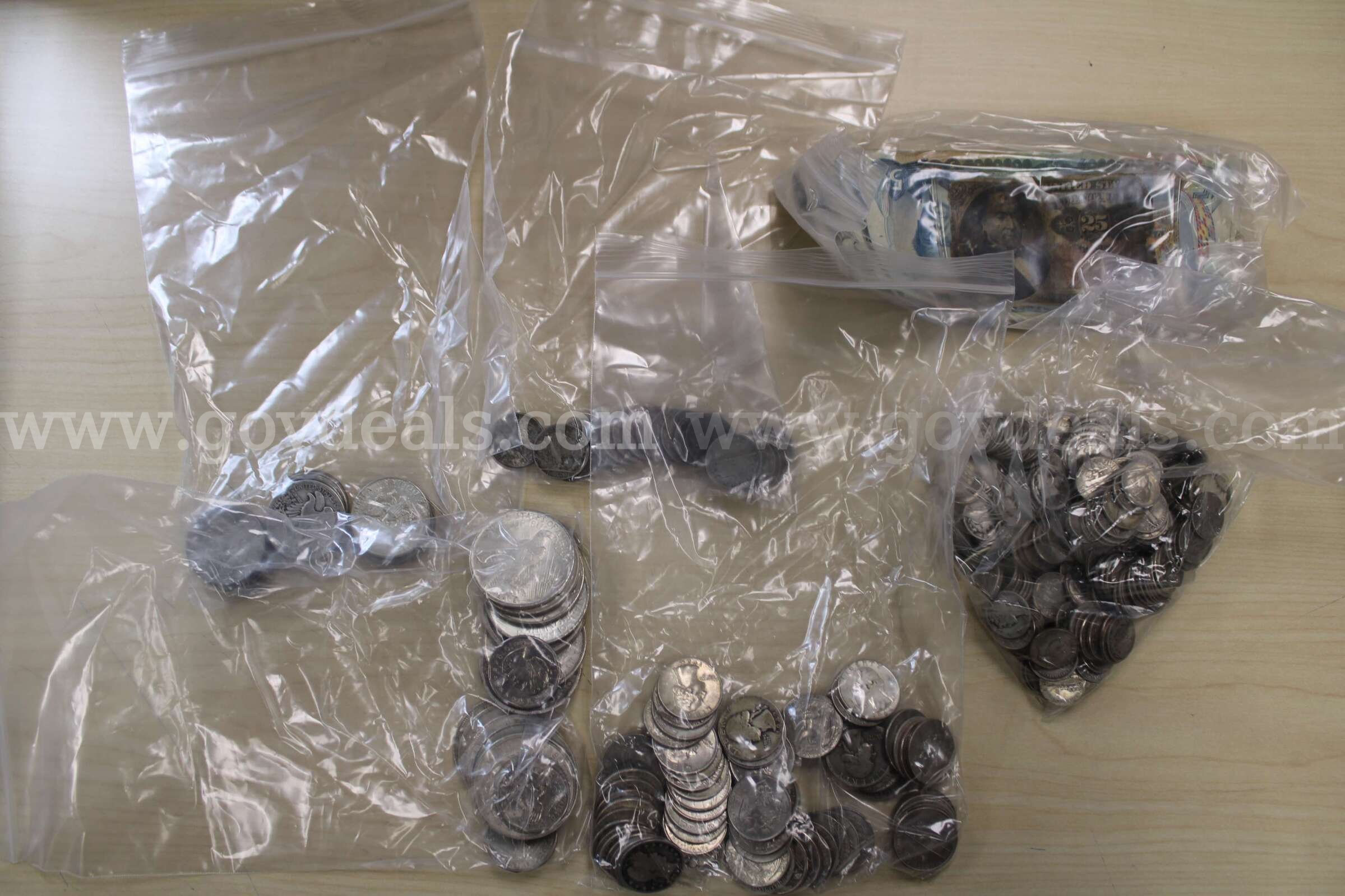 $5.00 BILL (2), $2.00 BILL (1), $1.00 BILL (32), 0.10 COIN (241)  0.05 COIN (23)  241 Government Surplus Auction - Primary Photo