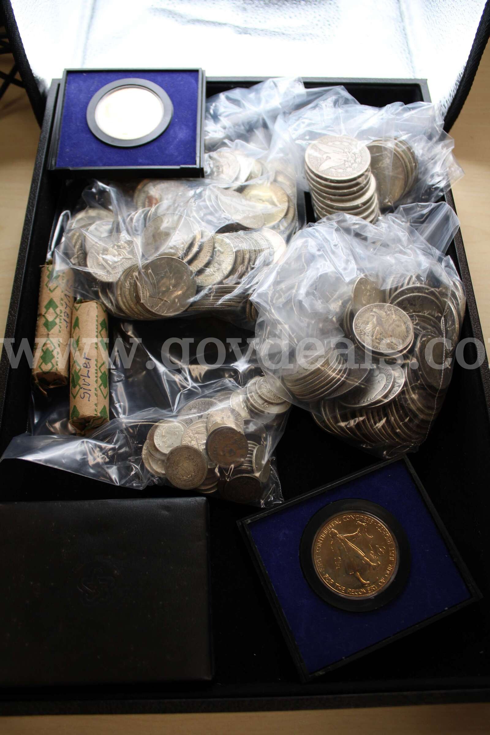 COLLECTABLE COINS (2); DIME, ROLLED (2); $1 COIN (16); HALF DOLLAR (100)  100 Government Surplus Auction - Primary Photo