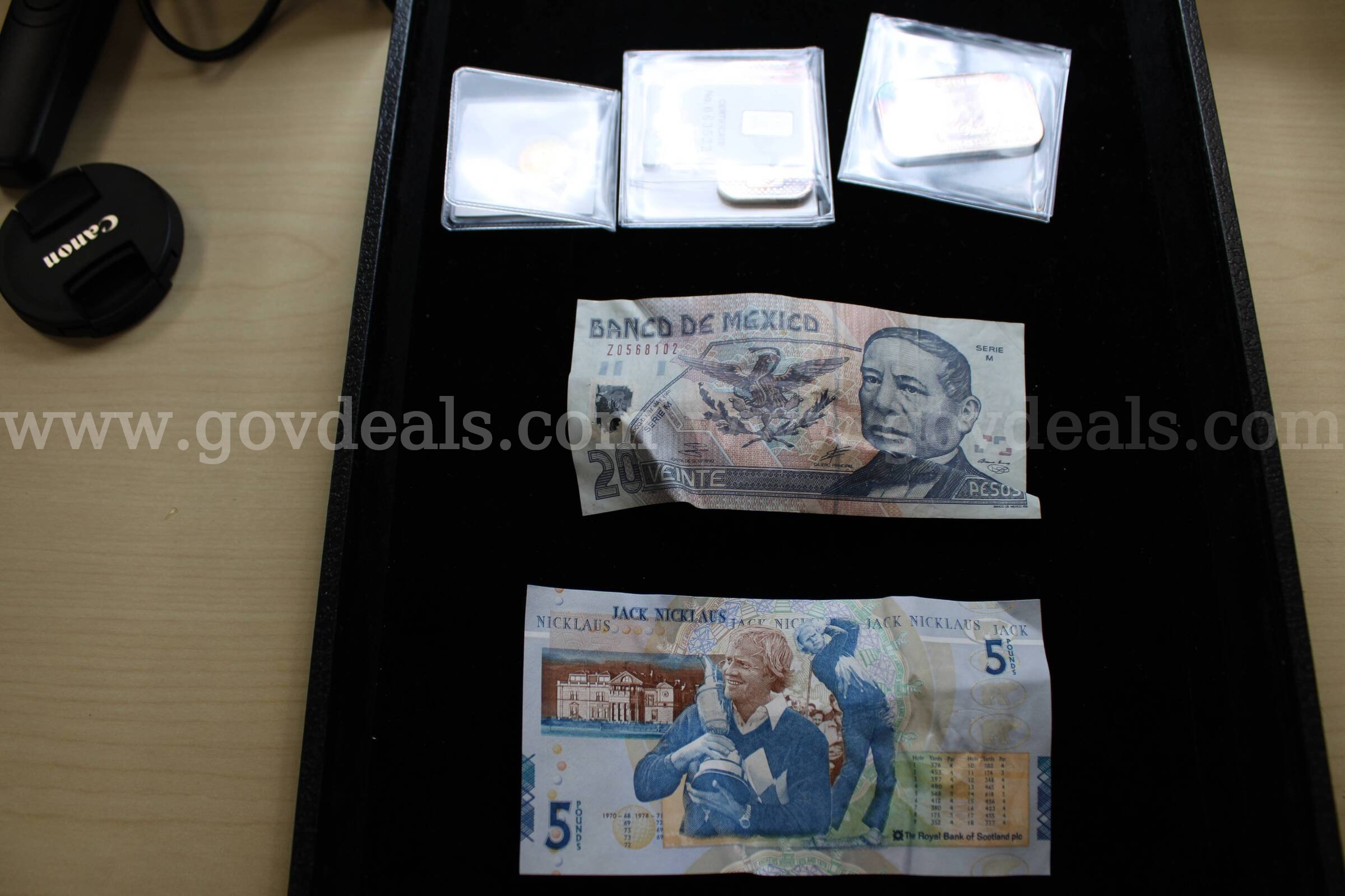 METAL BARS (2),  FOREIGN BILLS (2),  FOREIGN COIN (1)   Government Surplus Auction - Primary Photo
