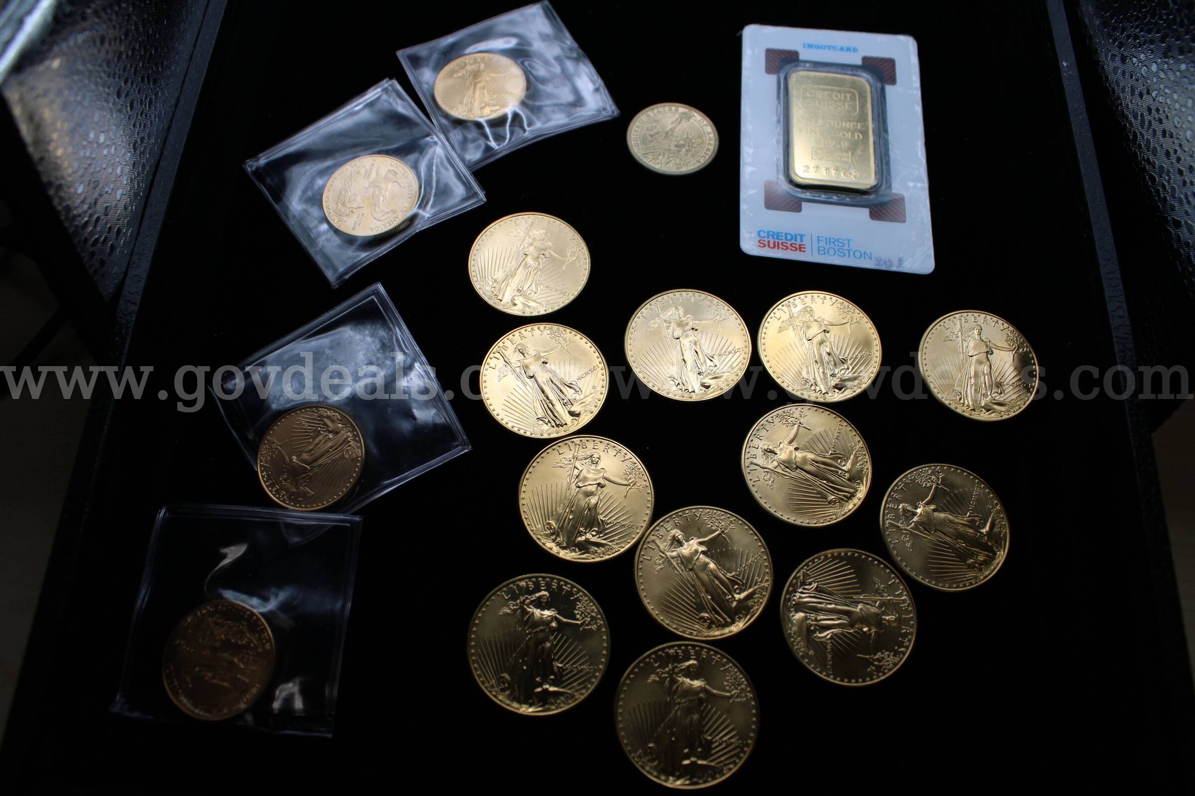 METAL BAR (1); $1 COIN (1); $25 COIN (4); $50 COIN (12)   Government Surplus Auction - Primary Photo