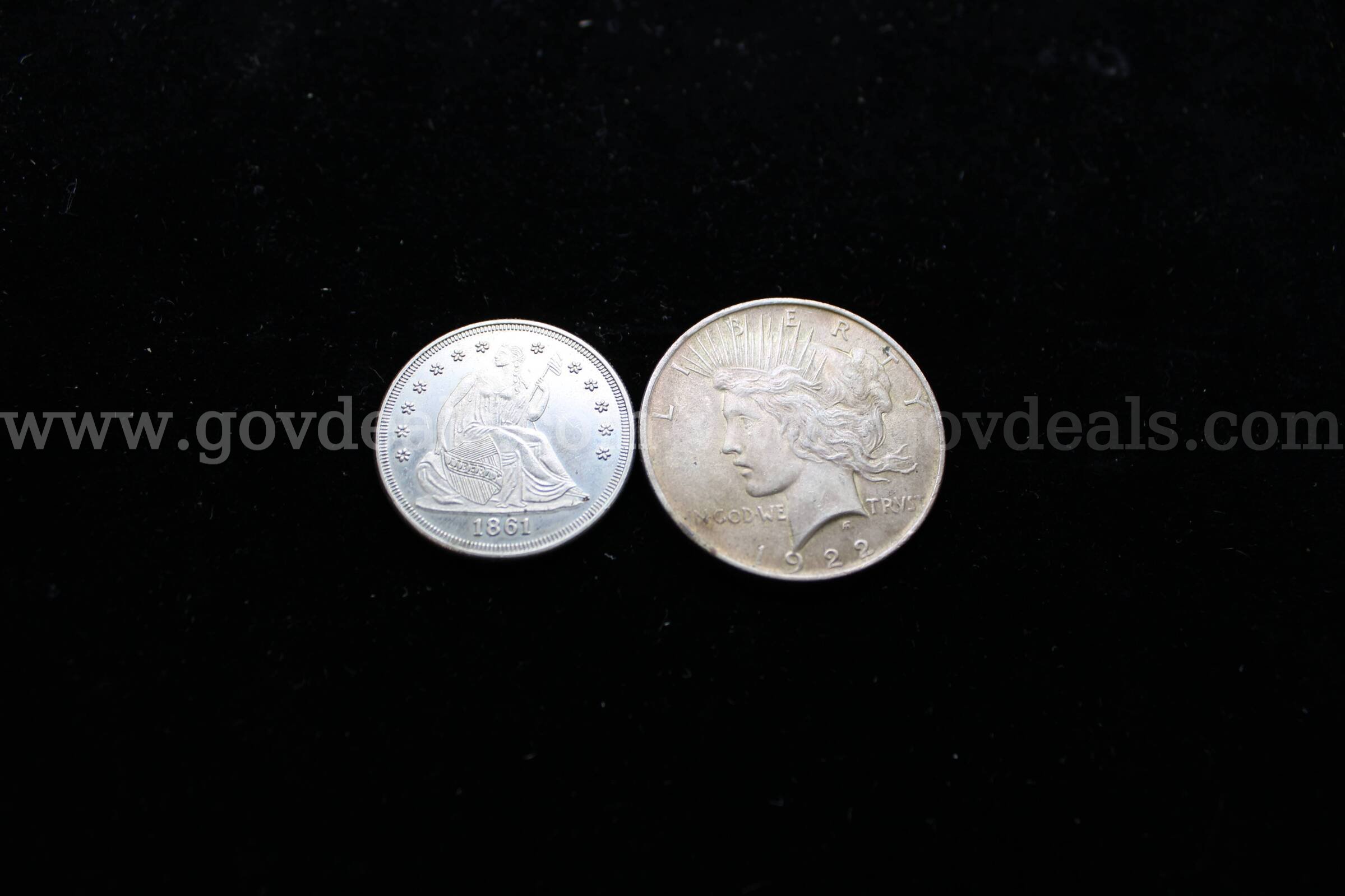 $1 COIN (1); HALF DOLLAR (1)   Government Surplus Auction - Primary Photo