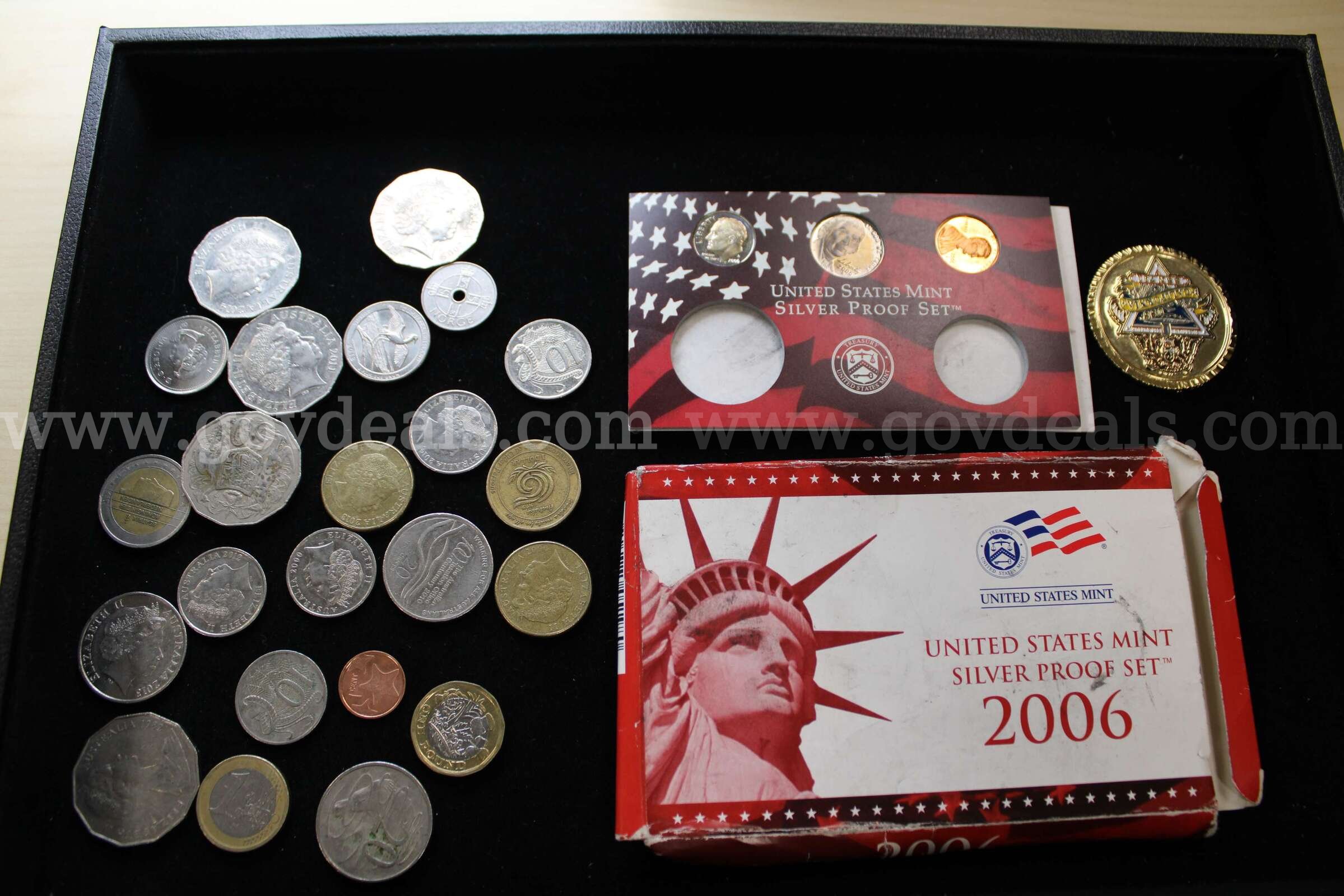COLLECTORS COIN (1); PROOF SET (1); FOREIGN COINS (23)   Government Surplus Auction - Primary Photo