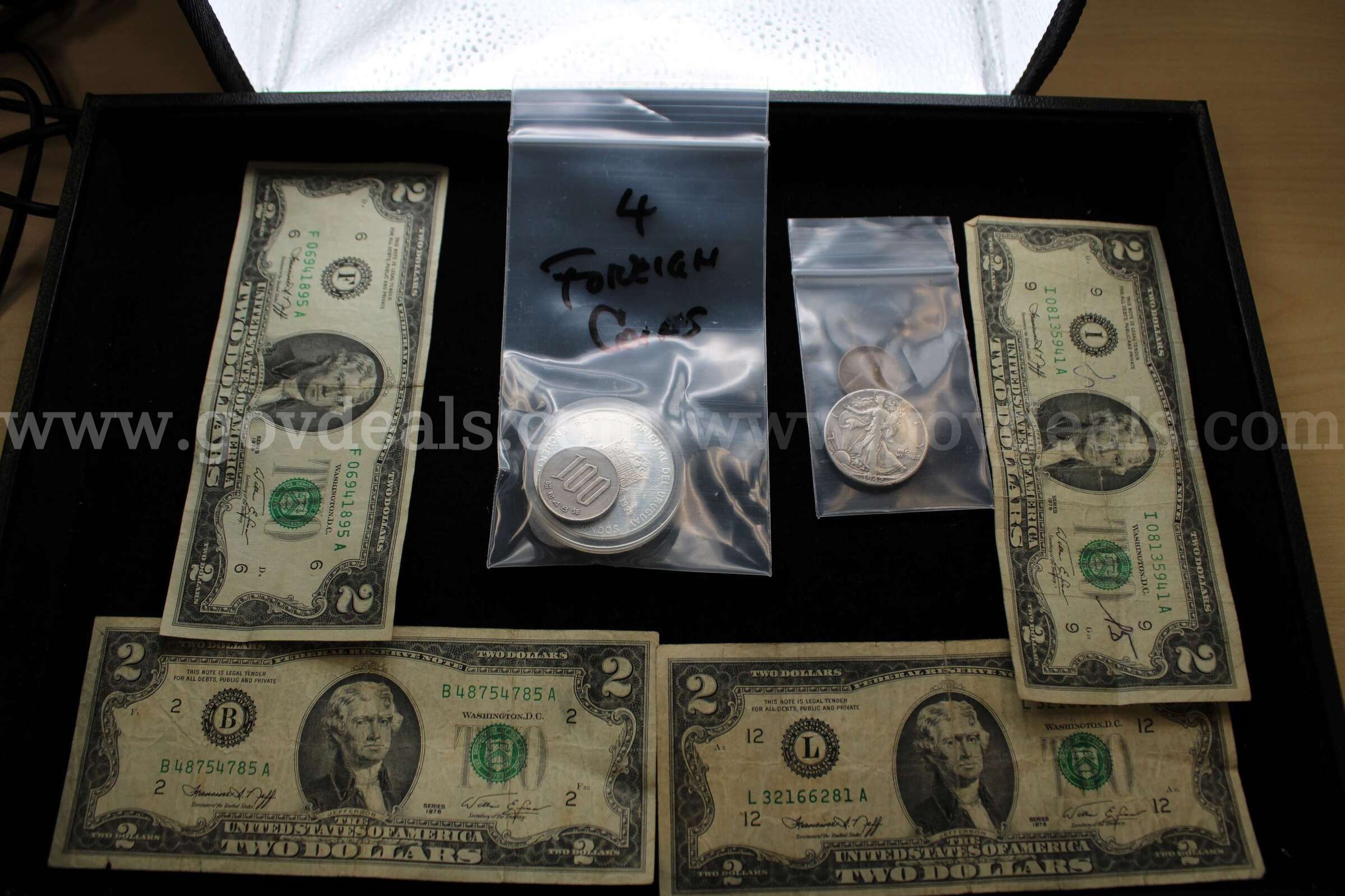 $2.00 Bill (4)  Half Dollar (1)  Penny (1) Foreign Coin (4)   Government Surplus Auction - Primary Photo