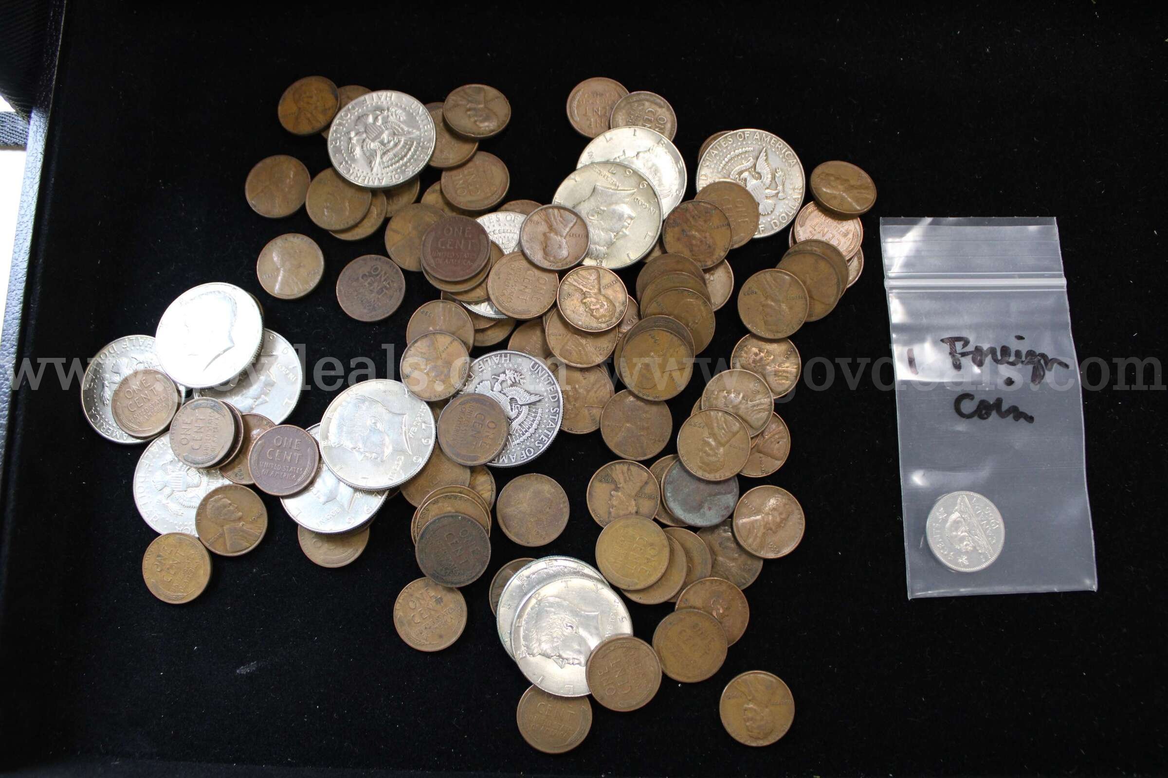 HALF $ (14); DIME (1); PENNY (100); FOREIGN COIN (1)  100 Government Surplus Auction - Primary Photo