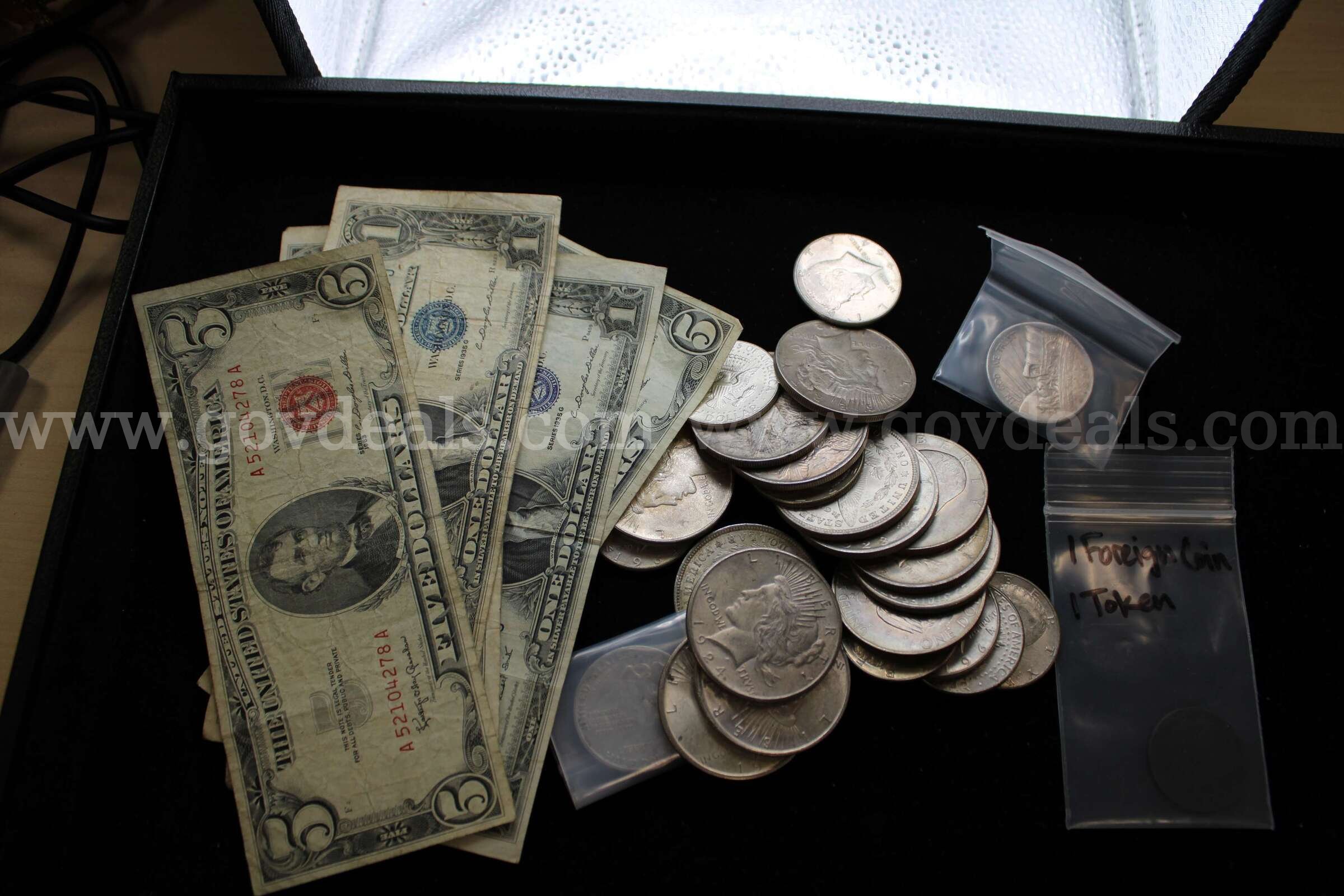 $5 BILL (3); $1 BILL (9); $1 COIN (14); HALF $ (11); FOREIGN COIN (1)   Government Surplus Auction - Primary Photo