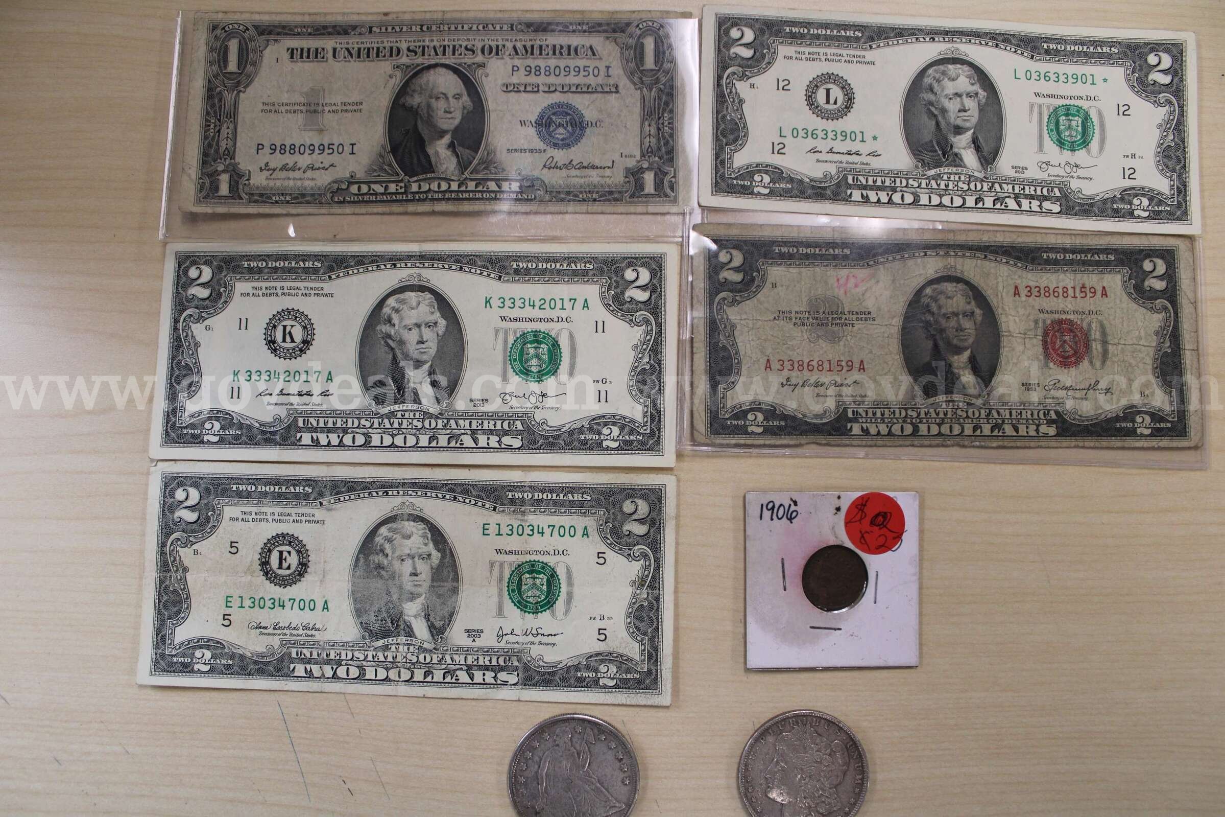 $2 BILL (4); $1 BILL (1); $1 COIN (2); PENNY (1)   Government Surplus Auction - Primary Photo