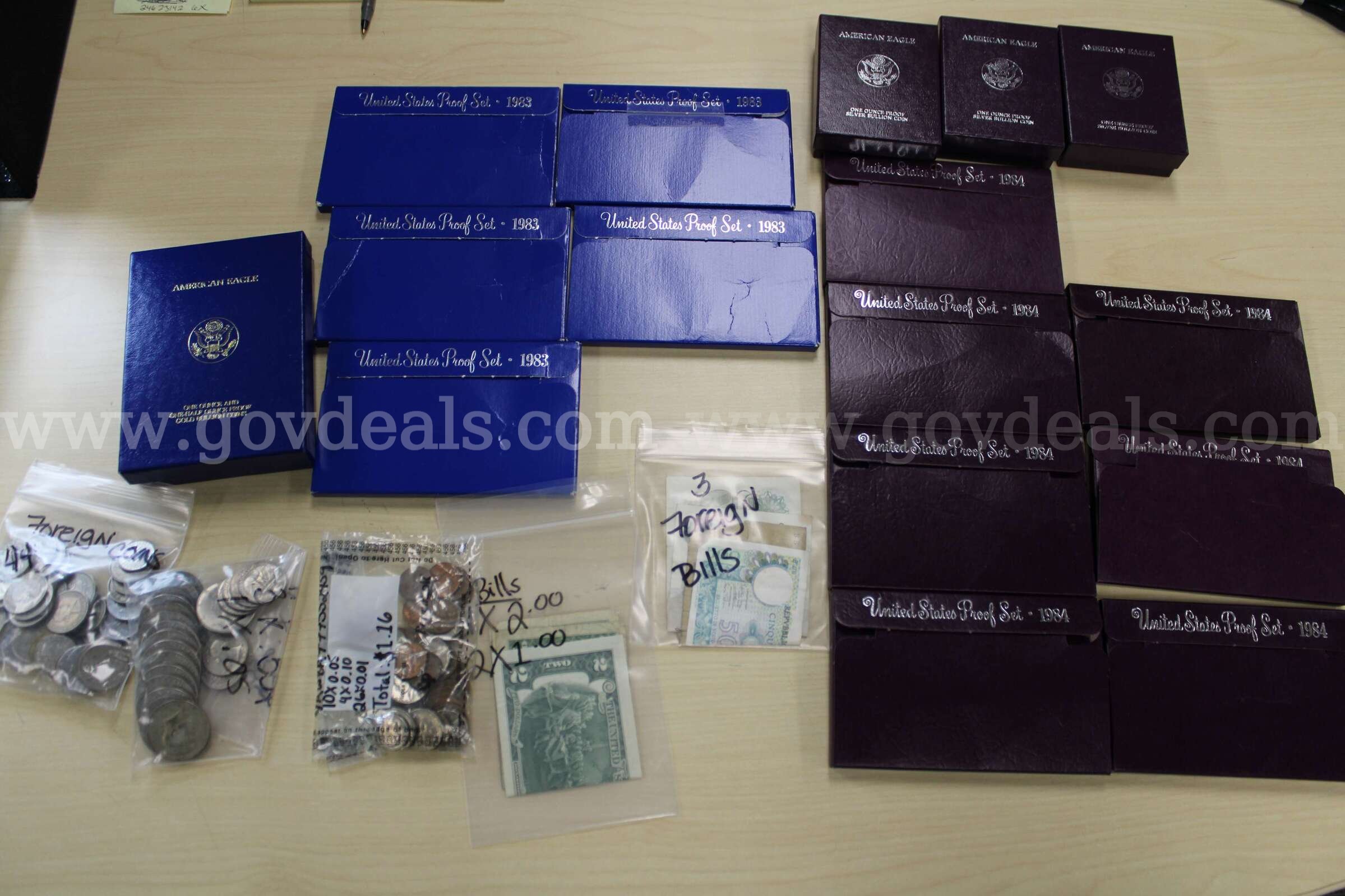 Proof Set (12)   $1.00 coins (3)  Mints Set (1)  Foreign Coins (44)  Foreign Bil   Government Surplus Auction - Primary Photo