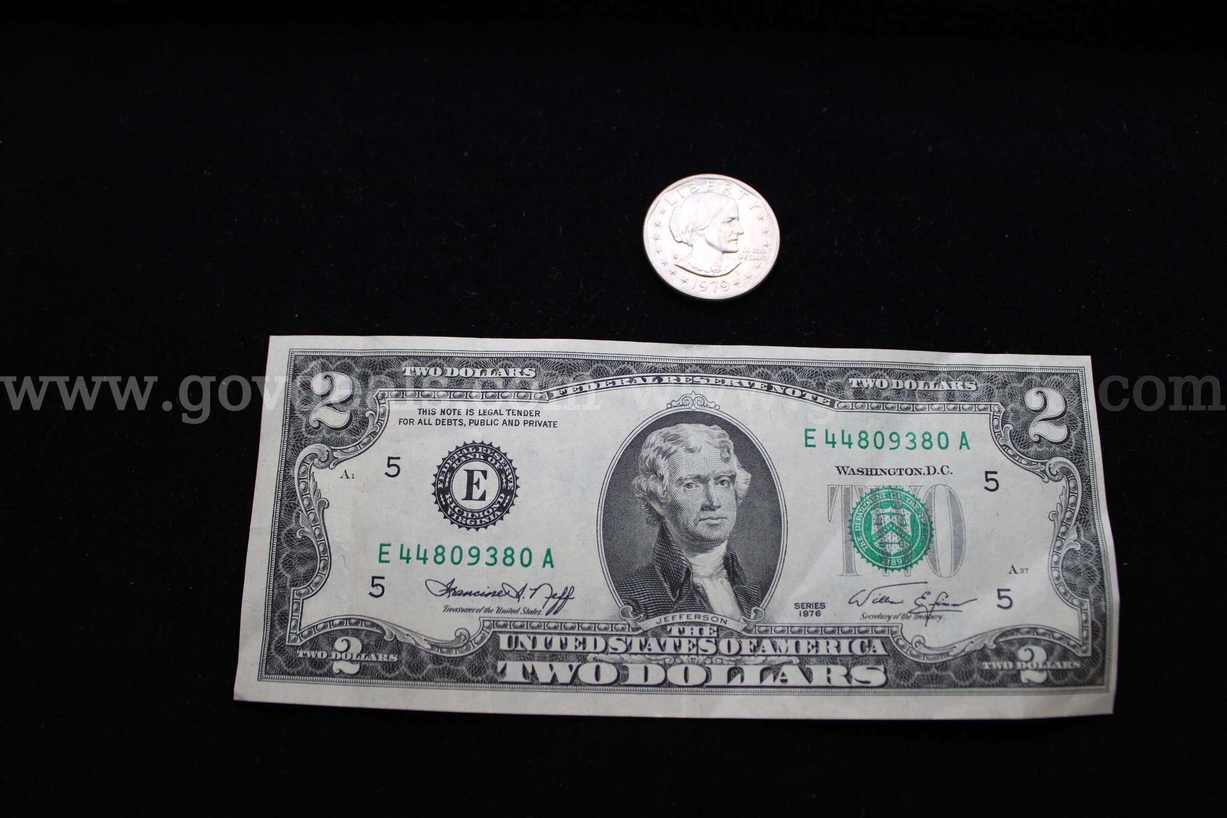 $2 BILL (1); $1 COIN (1)   Government Surplus Auction - Primary Photo