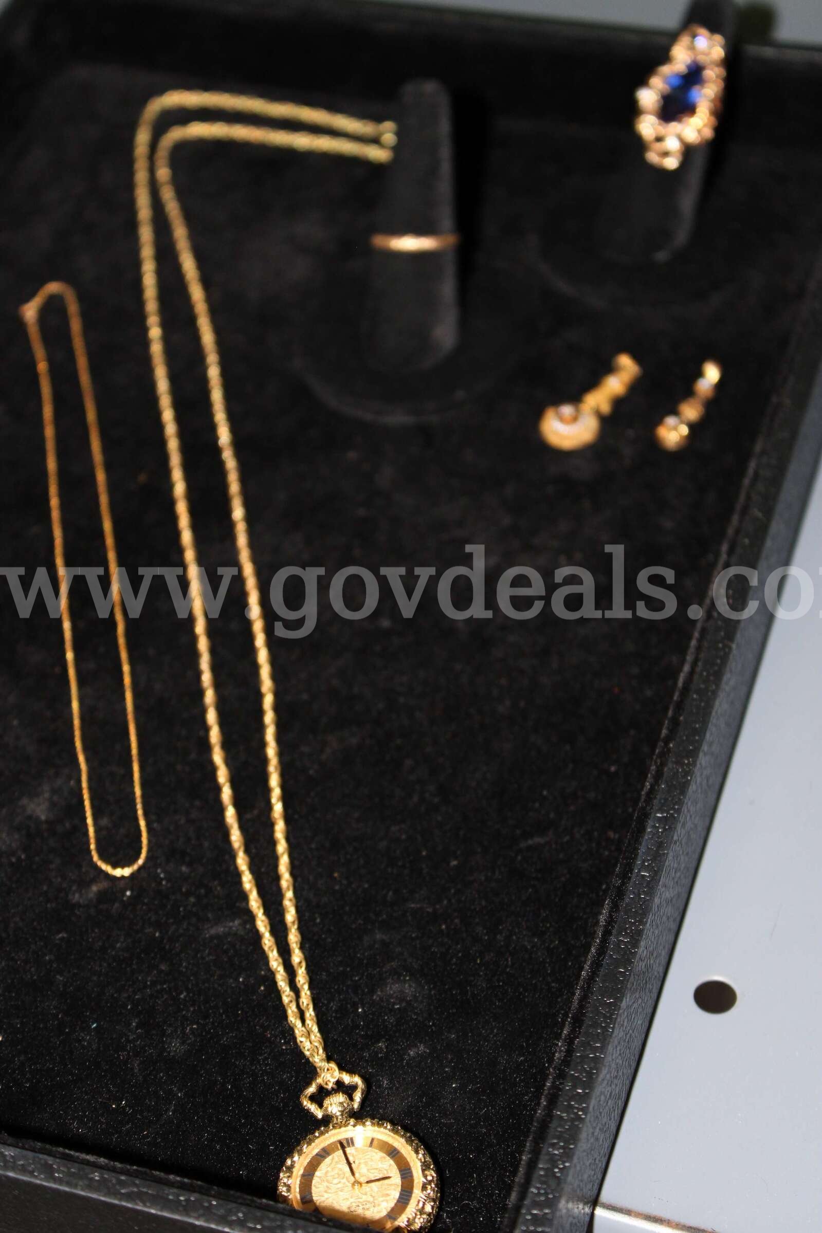 Pocket Watch (2)    Rings (2)     Charm (1)    Earrings (2)     Chain (1)   Government Surplus Auction - Primary Photo