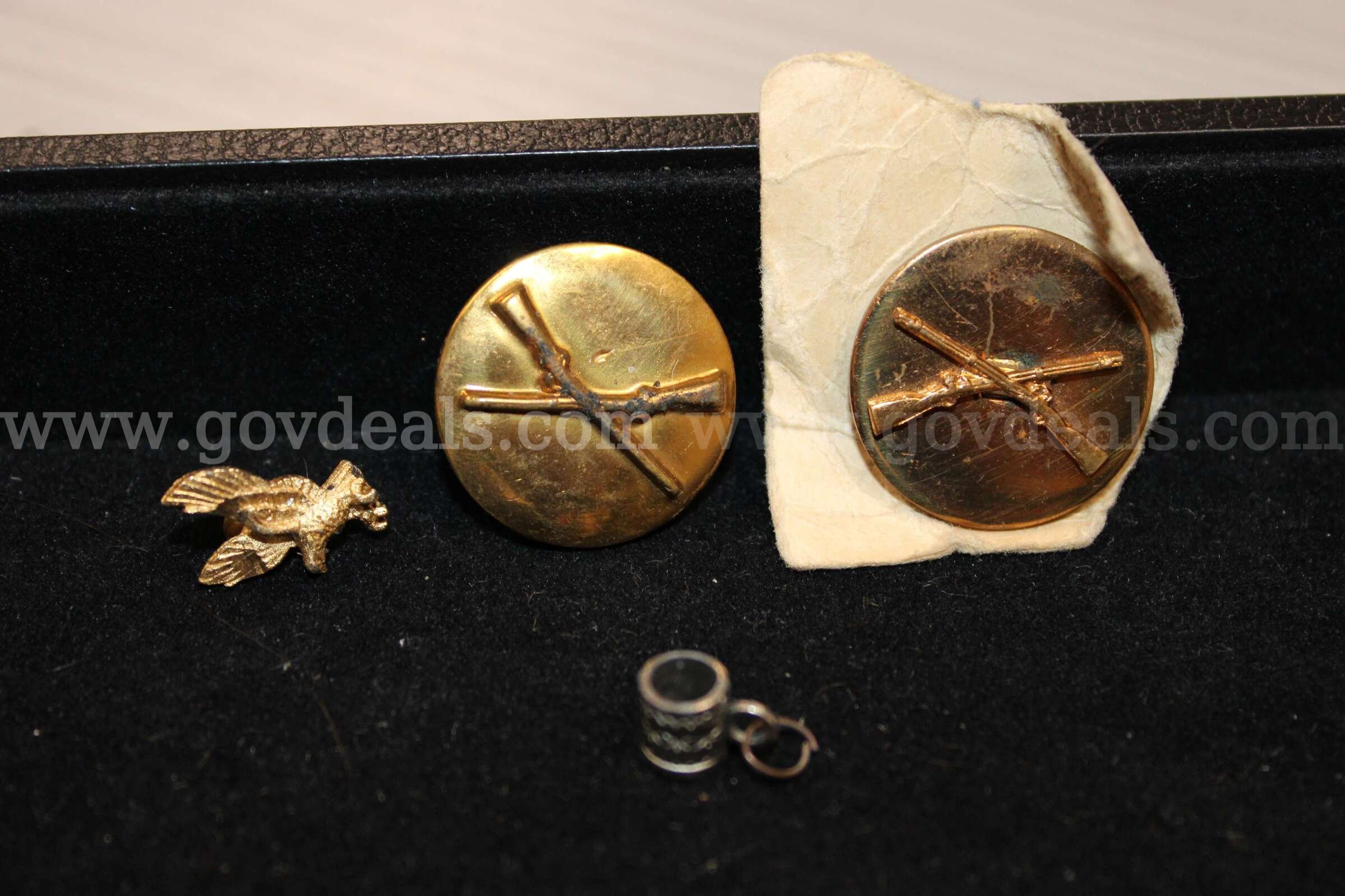 3 GOLD PINS, 1 SILVER CHARM   Government Surplus Auction - Primary Photo