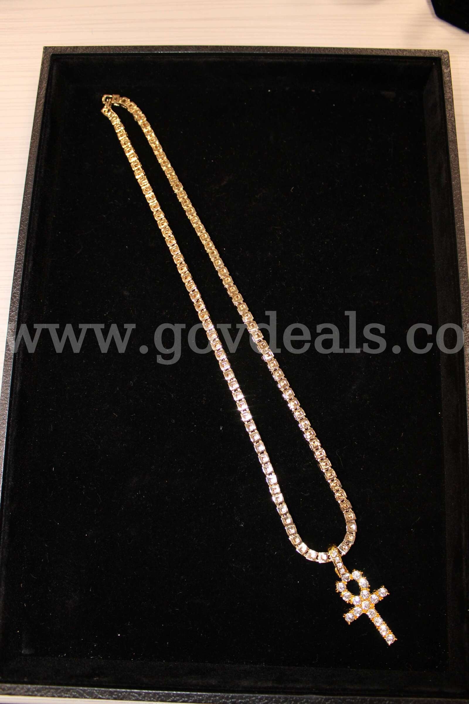 GOLD NECKLACE WITH PENDANT   Government Surplus Auction - Primary Photo