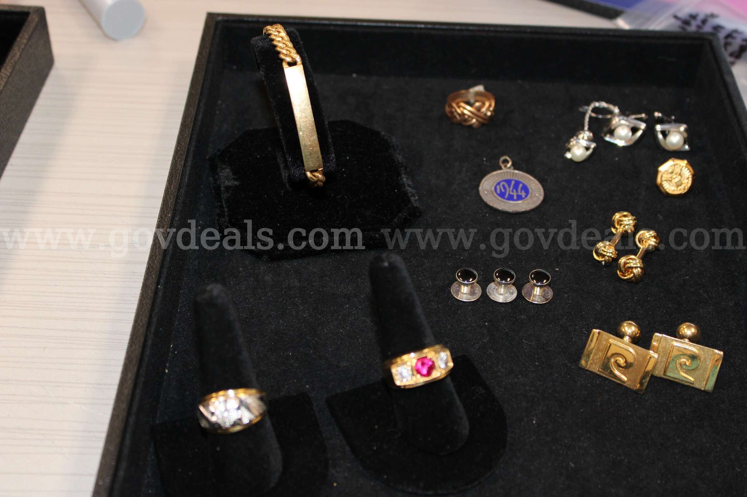 Watch (1)    Ring (3)     Bracelet (1)    Cuff Link Pair (3)  Tie (1)   Charm (1   Government Surplus Auction - Primary Photo