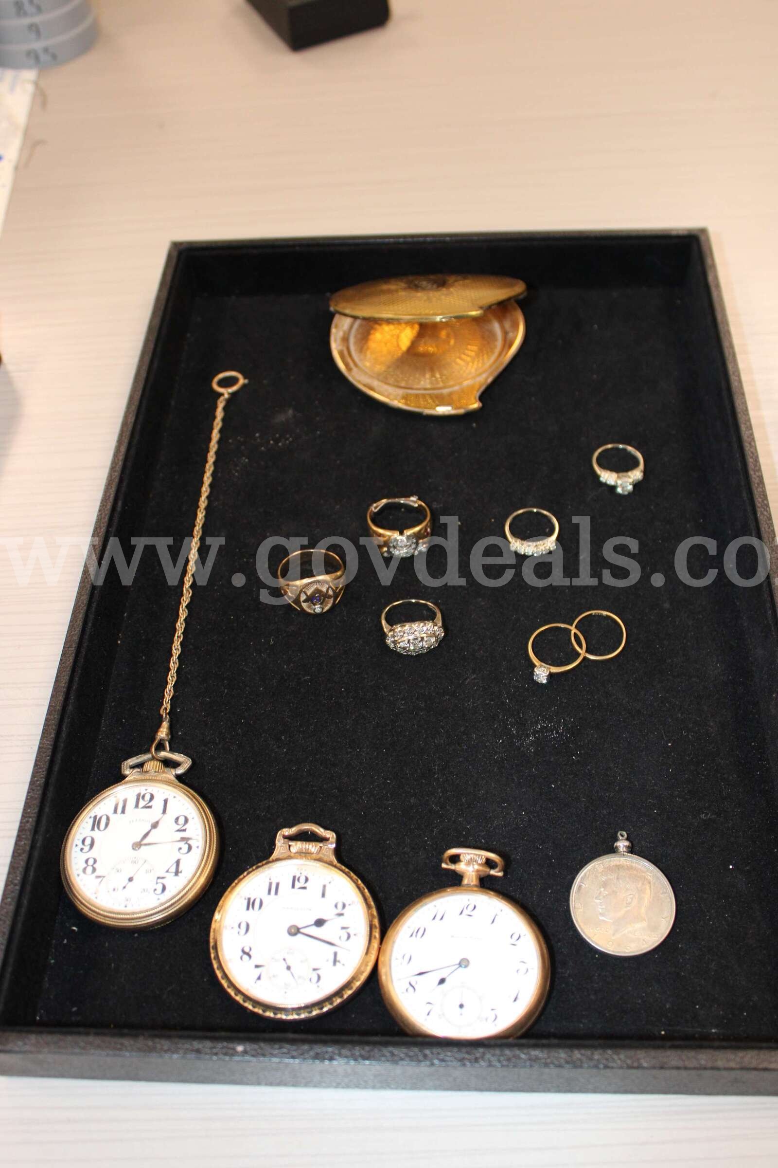 POCKET WATCH (3); RINGS (7); LOOSE STONE (1); CHARM WITH COIN (1); MIRROR (1)   Government Surplus Auction - Primary Photo
