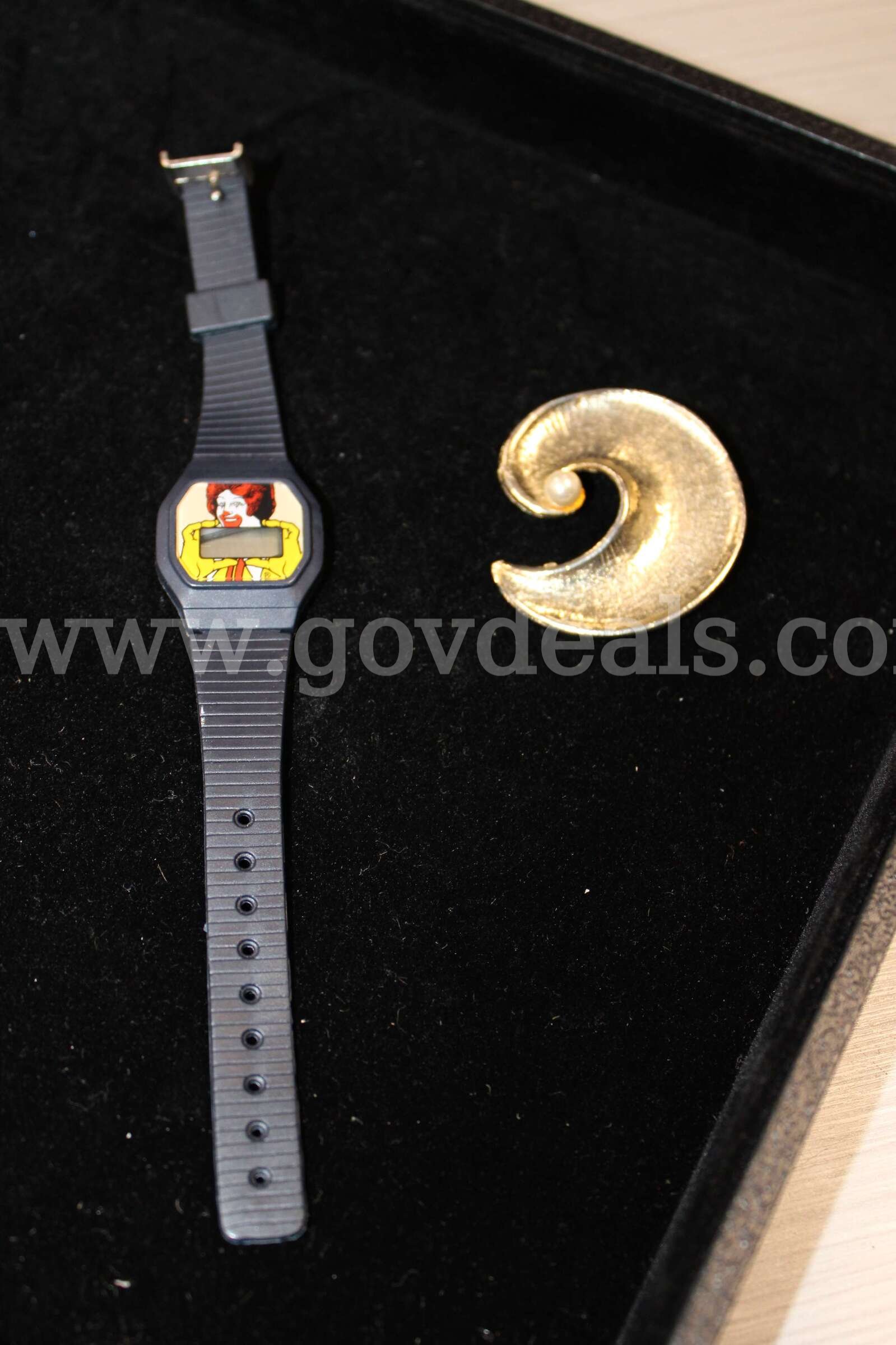 1 Watch     1 Brooch   Government Surplus Auction - Primary Photo