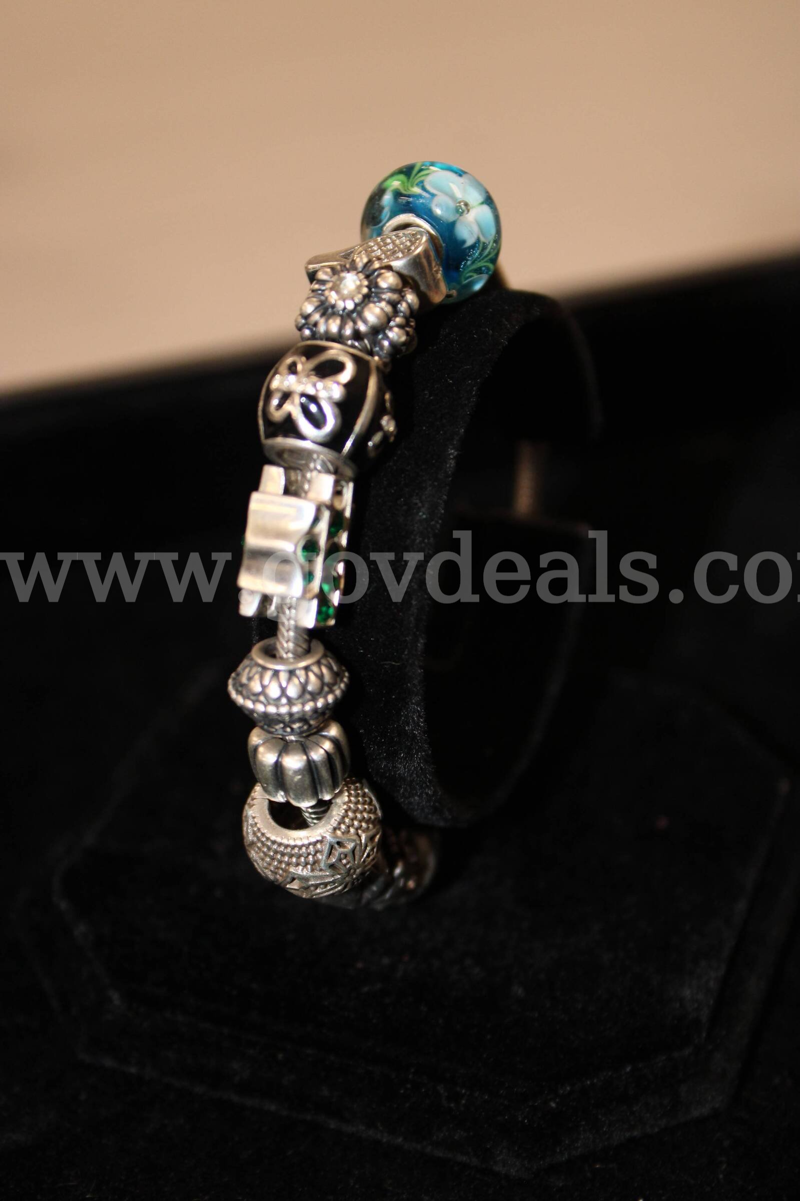 PANDORA BRACELET, BRACELET SILVER IN COLOR WITH CHARMS   Government Surplus Auction - Primary Photo