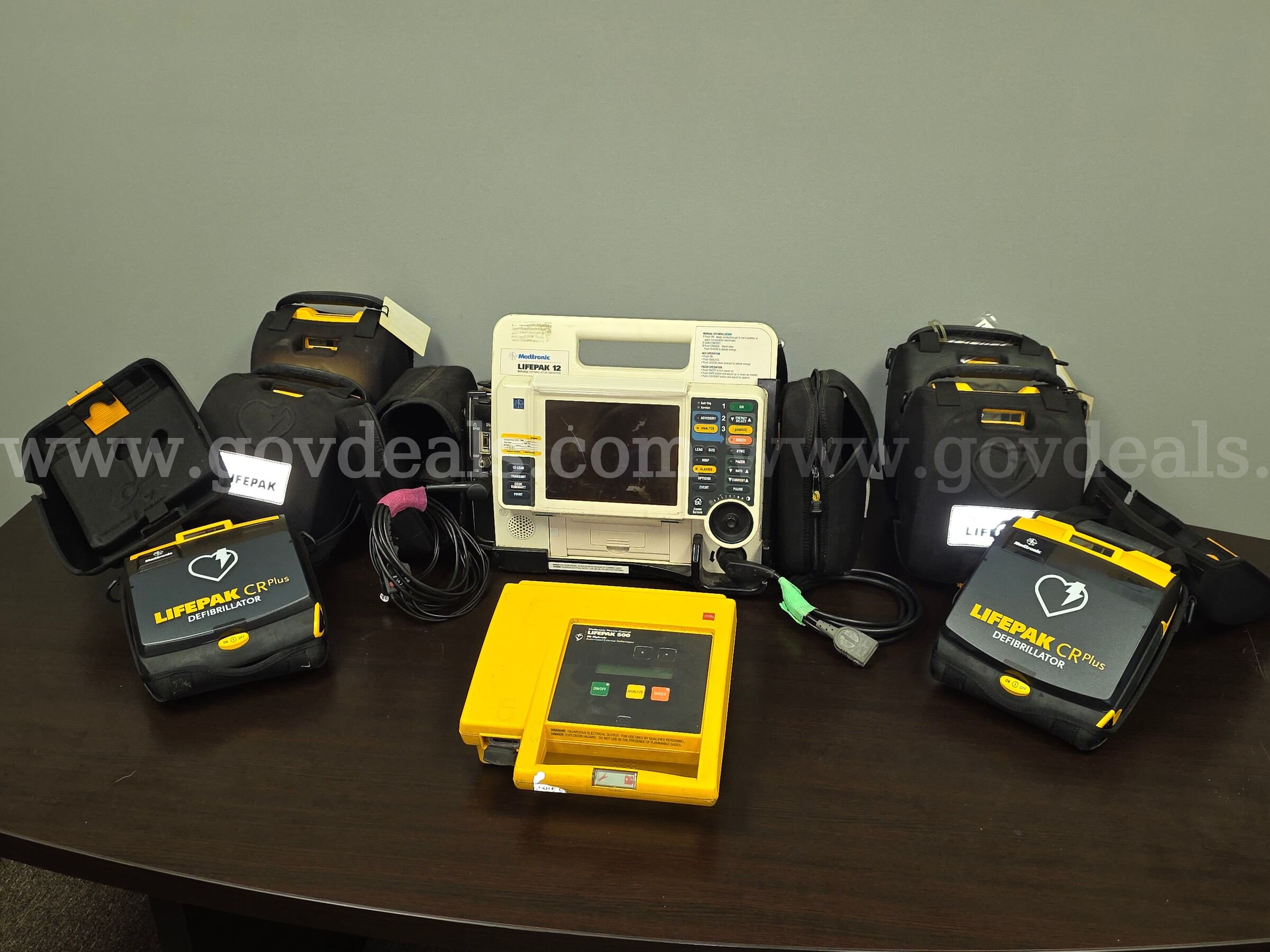 1 LifePak-12 with Defib cable and 4 Lead cable, NO Batteries for the LP-12, 6 CR+ AEDs, LifePak500 AED, Physio Control LifePak-12, CR+, LifePak500 Government Surplus Auction - Primary Photo