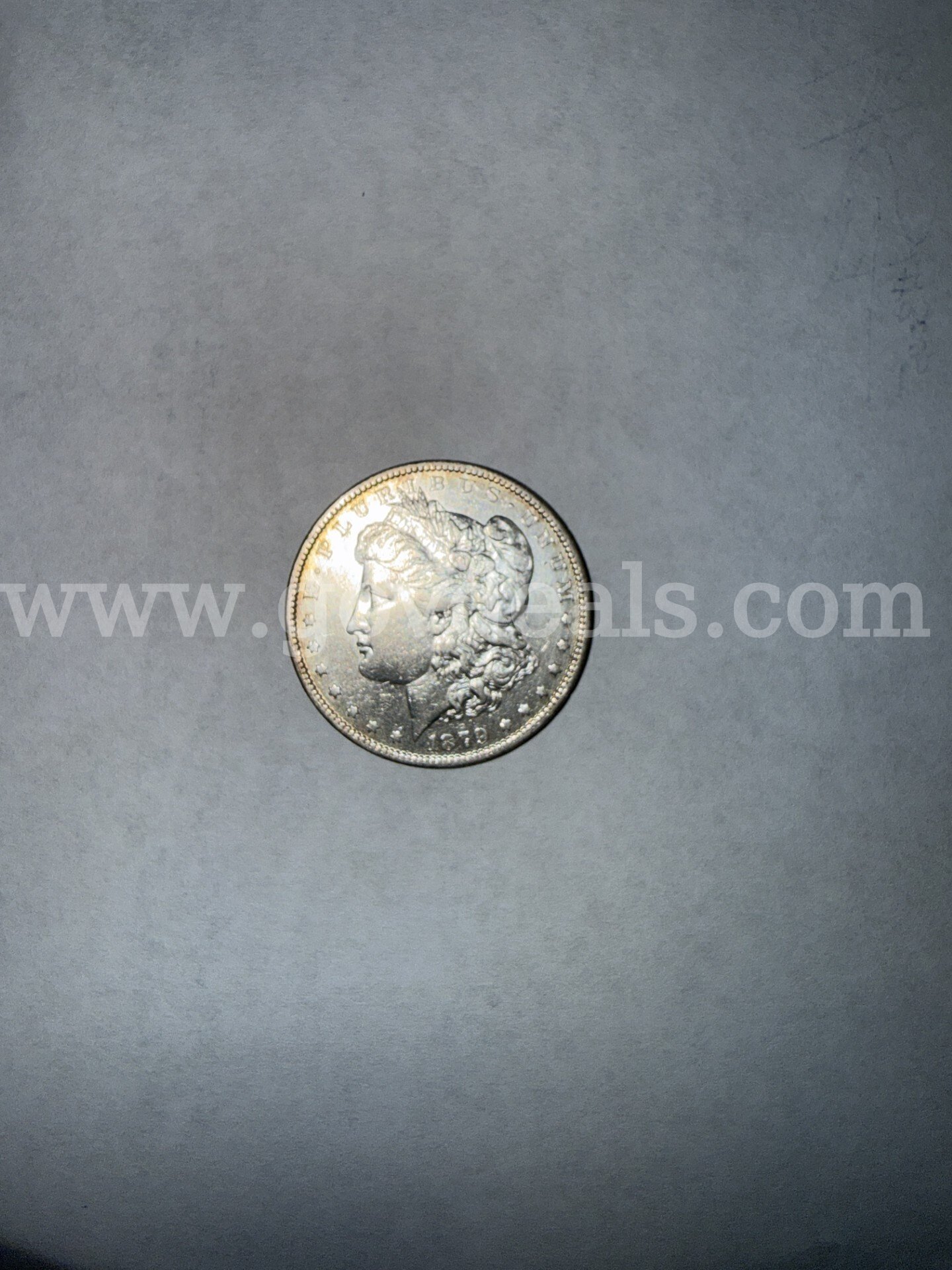 This is a 1879 Morgan silver dollar  1879 Government Surplus Auction - Photo #2