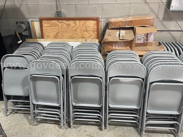 LOT of 95 Metal folding Chairs   Government Surplus Auction - Primary Photo