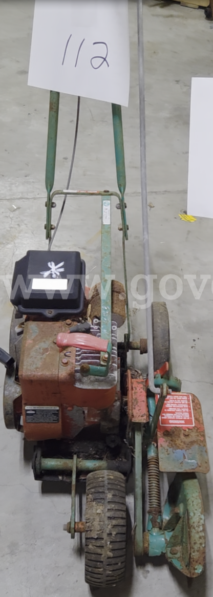 1998 Power Trim lawn edger Briggs & Stratton 4-cycle horizontal shaft engine   Government Surplus Auction - Primary Photo