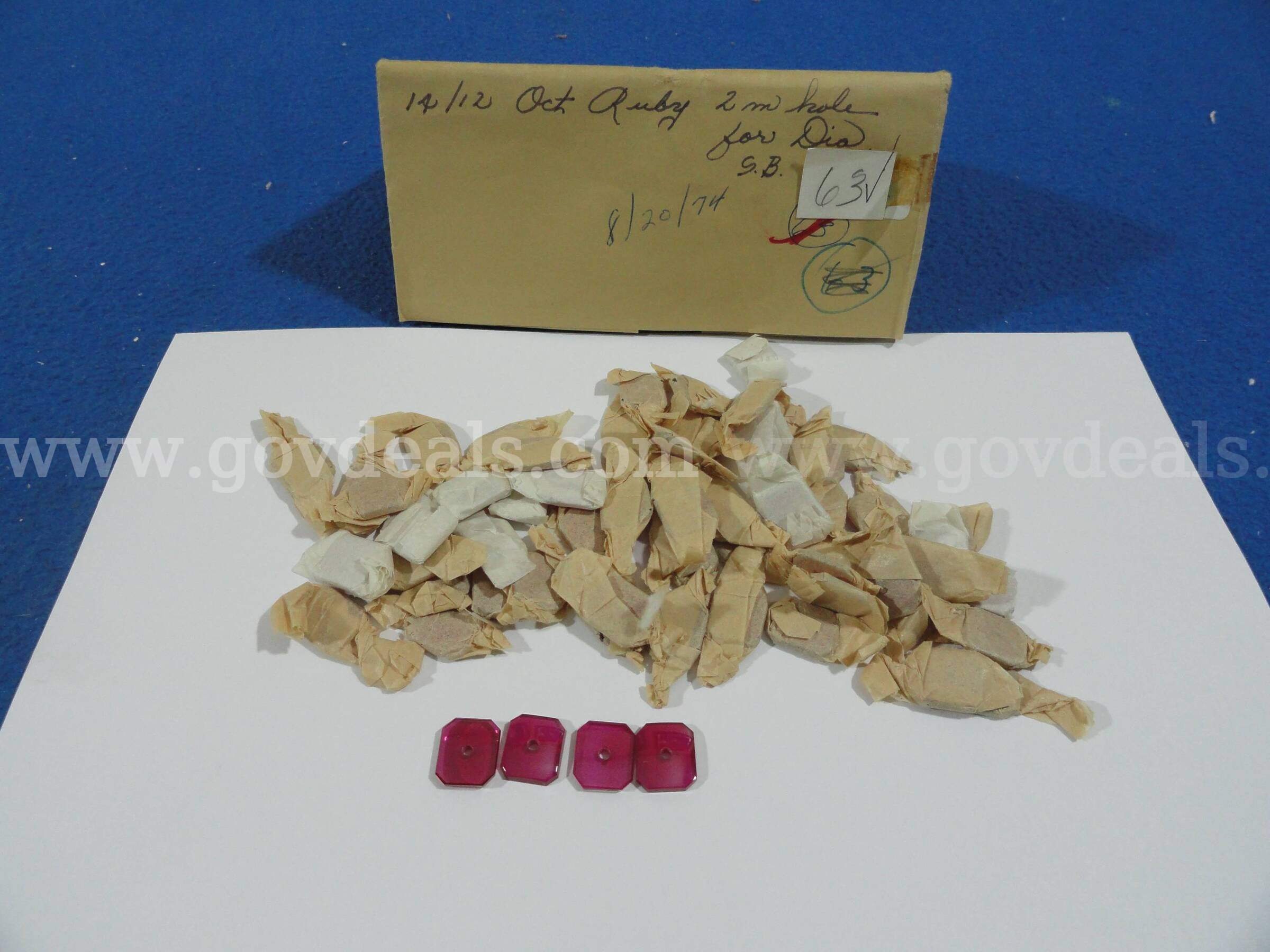 Lot of 63 Vintage 14x12mm Octagon Ruby Stones with 2mm Holes (1974 Stock)   Government Surplus Auction - Primary Photo