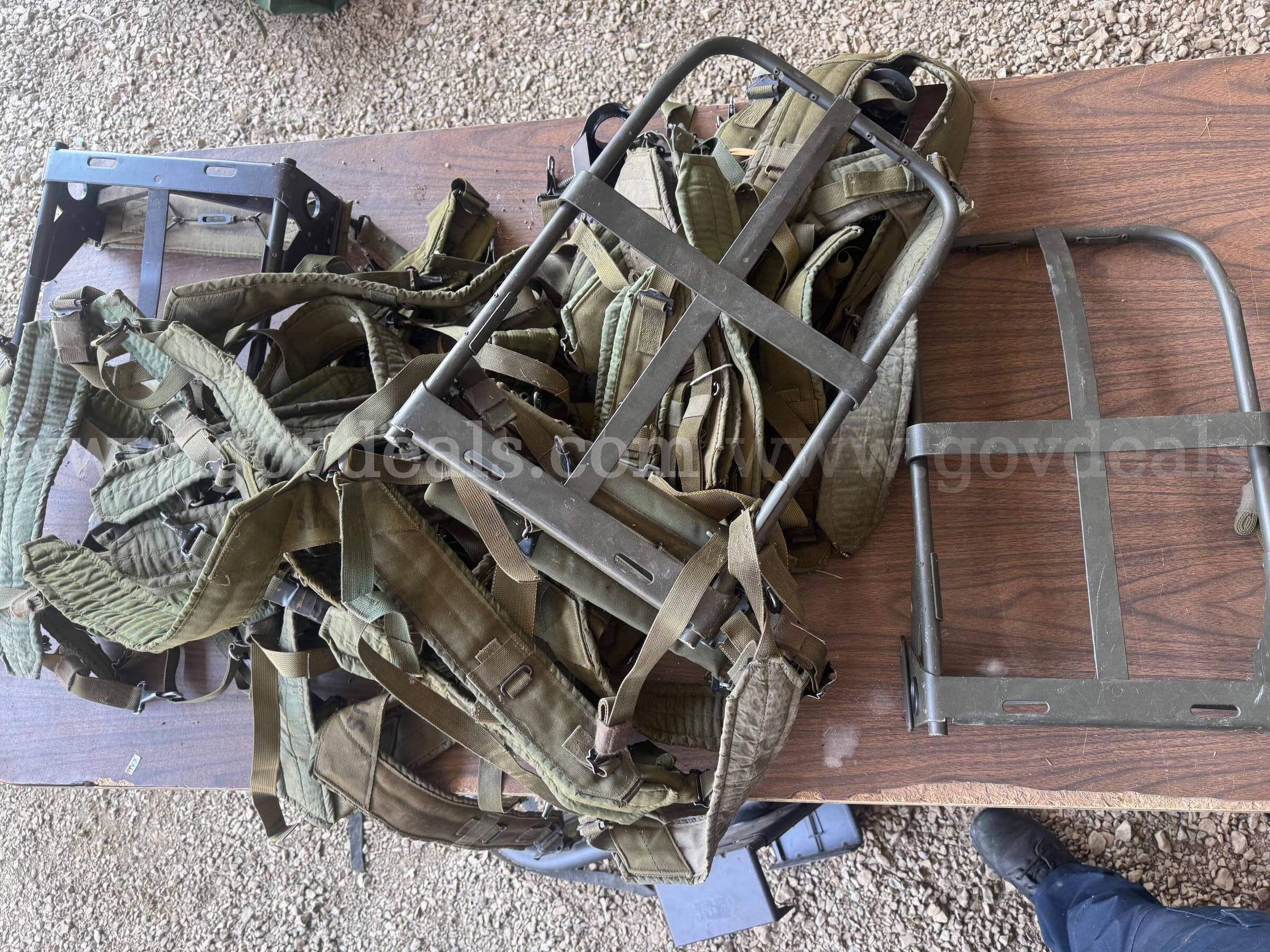 Metal external pack frames with padded shoulder harnesses and straps.   Government Surplus Auction - Photo #2