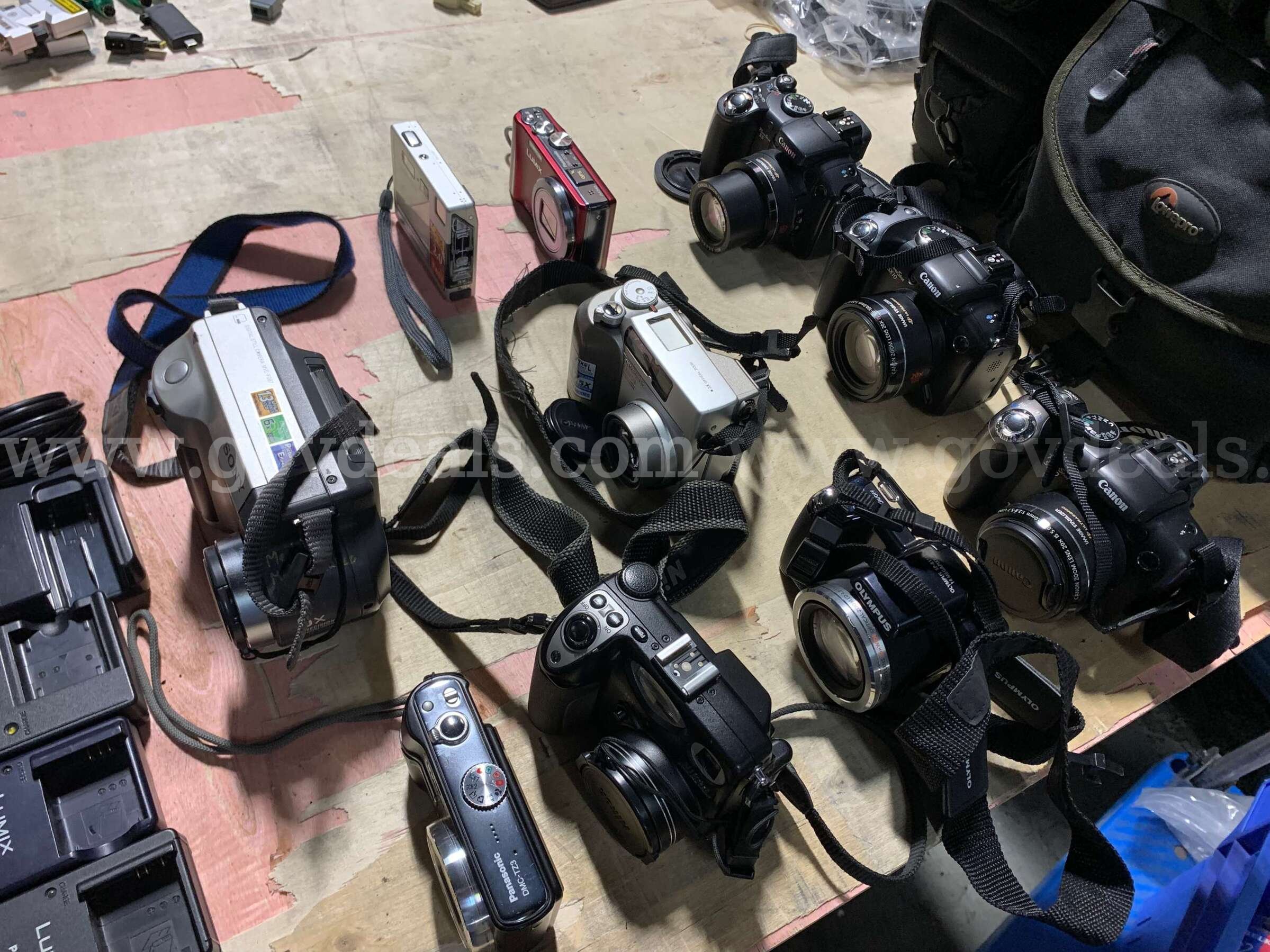 Lot of 15 Digital Cameras & Camera Battery Chargers – Canon, Panasonic, Sony, Nikon