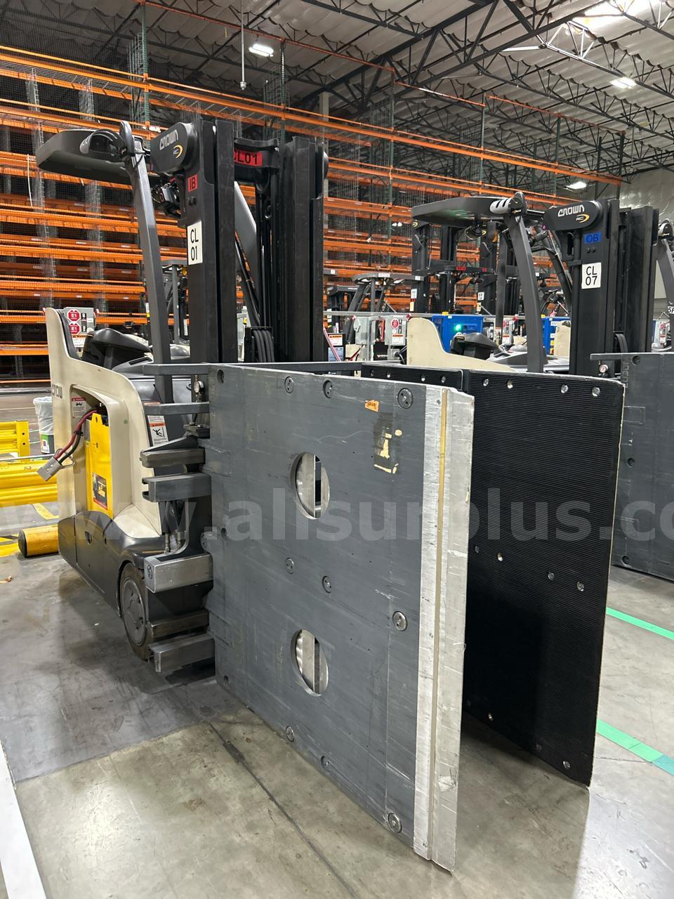 Crown RC 5500 Series Stand-Up Electric Forklift with Carton Clamp Crown 5500 Government Surplus Auction - Photo #2