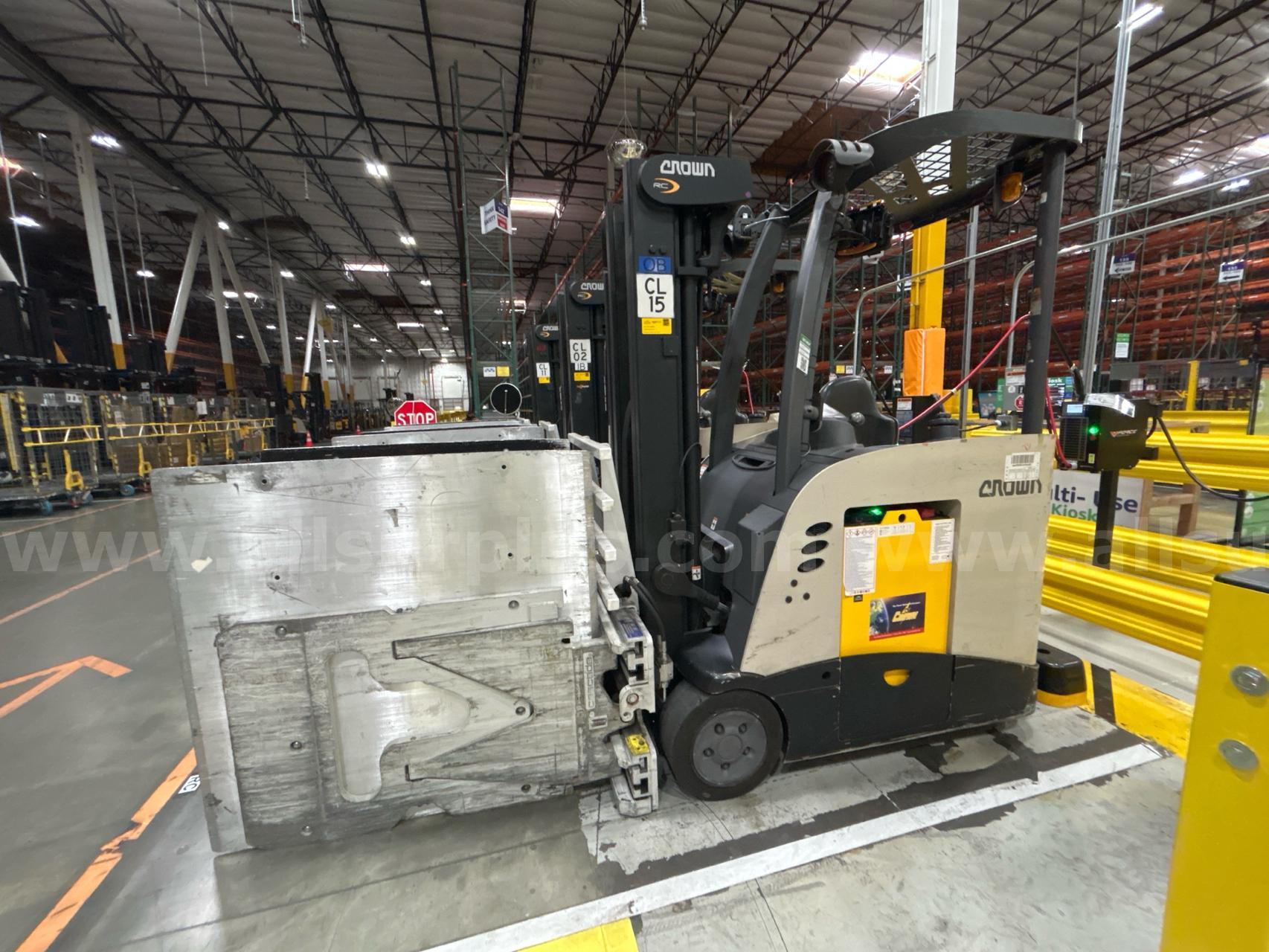 Crown RC 5500 Series Stand-Up Electric Forklift with Carton Clamp Crown 5500 Government Surplus Auction - Photo #2