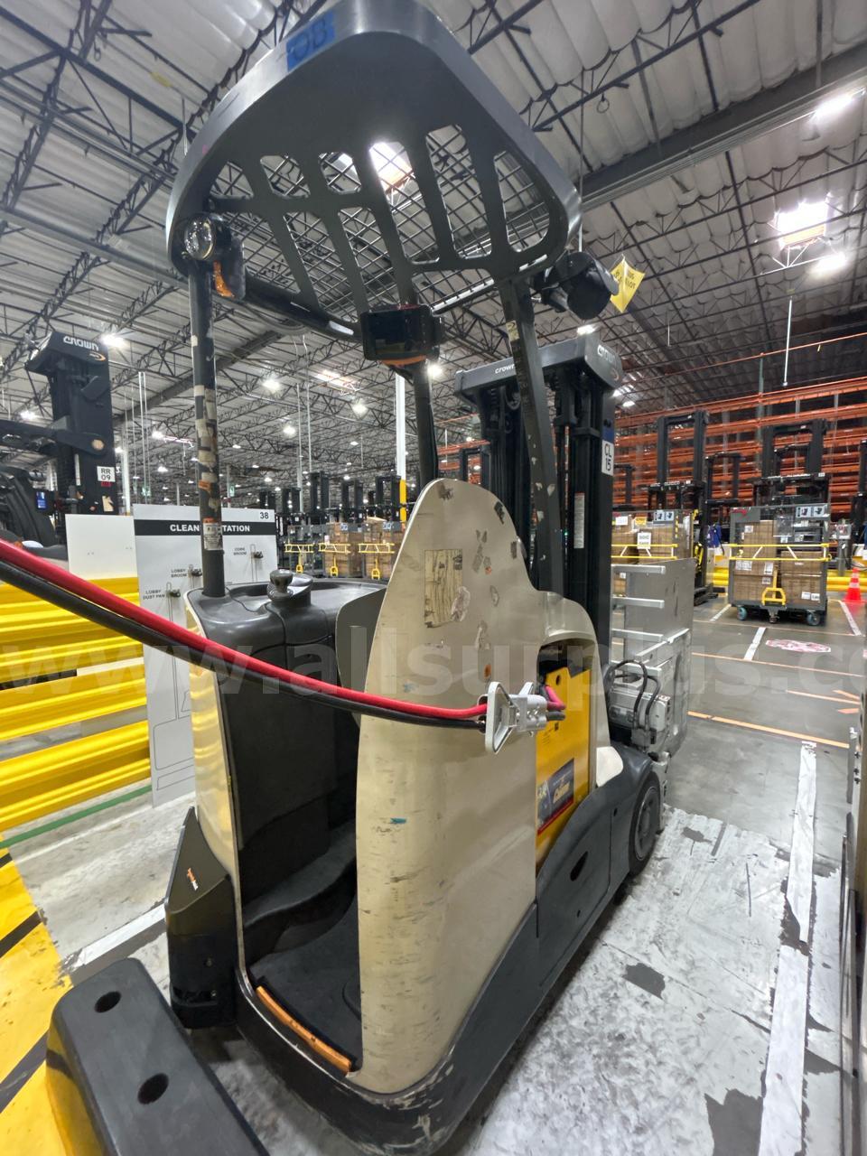 Crown RC 5500 Series Stand-Up Electric Forklift with Carton Clamp Crown 5500 Government Surplus Auction - Photo #6