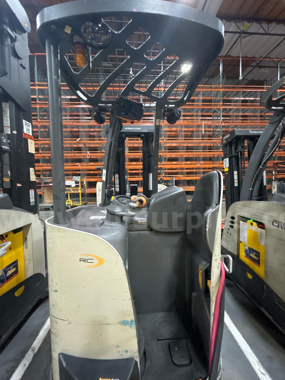 Crown RC 5500 Series Stand-Up Electric Forklift with Carton Clamp Crown 5500 Government Surplus Auction - Photo #6