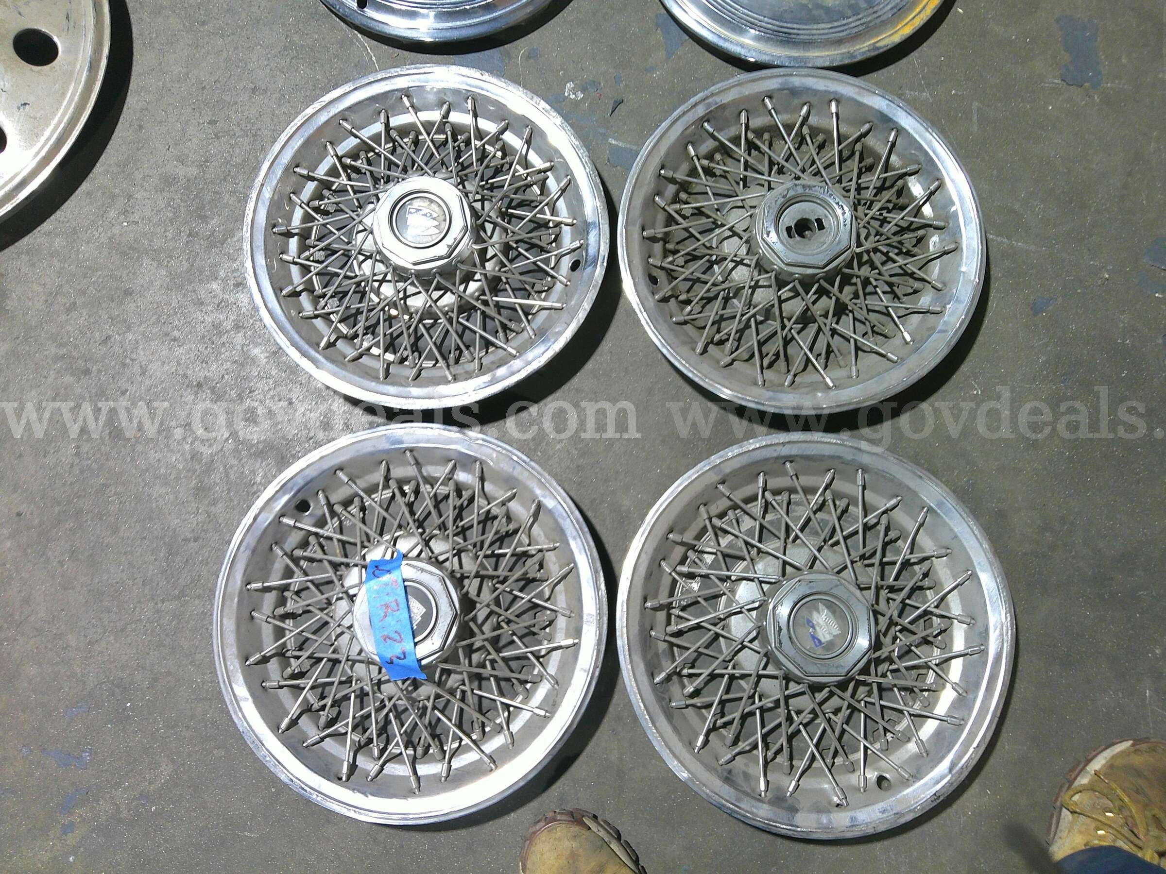Vintage GM wire spoke Hub cap 15 inch used on buick, regal, Buik centry   Government Surplus Auction - Primary Photo
