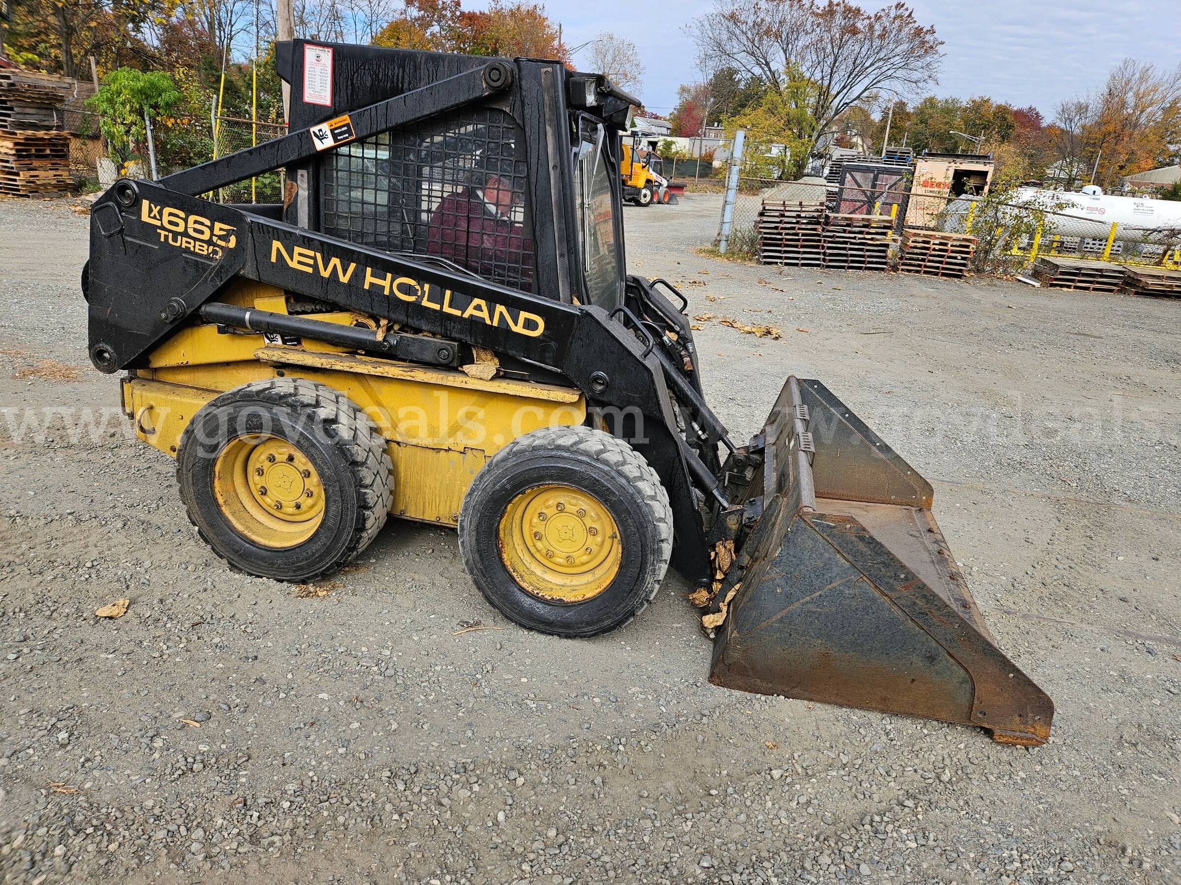 1996 New Holland LX665 Skid Steer Loader New Holland LX665 Government Surplus Auction - Photo #4