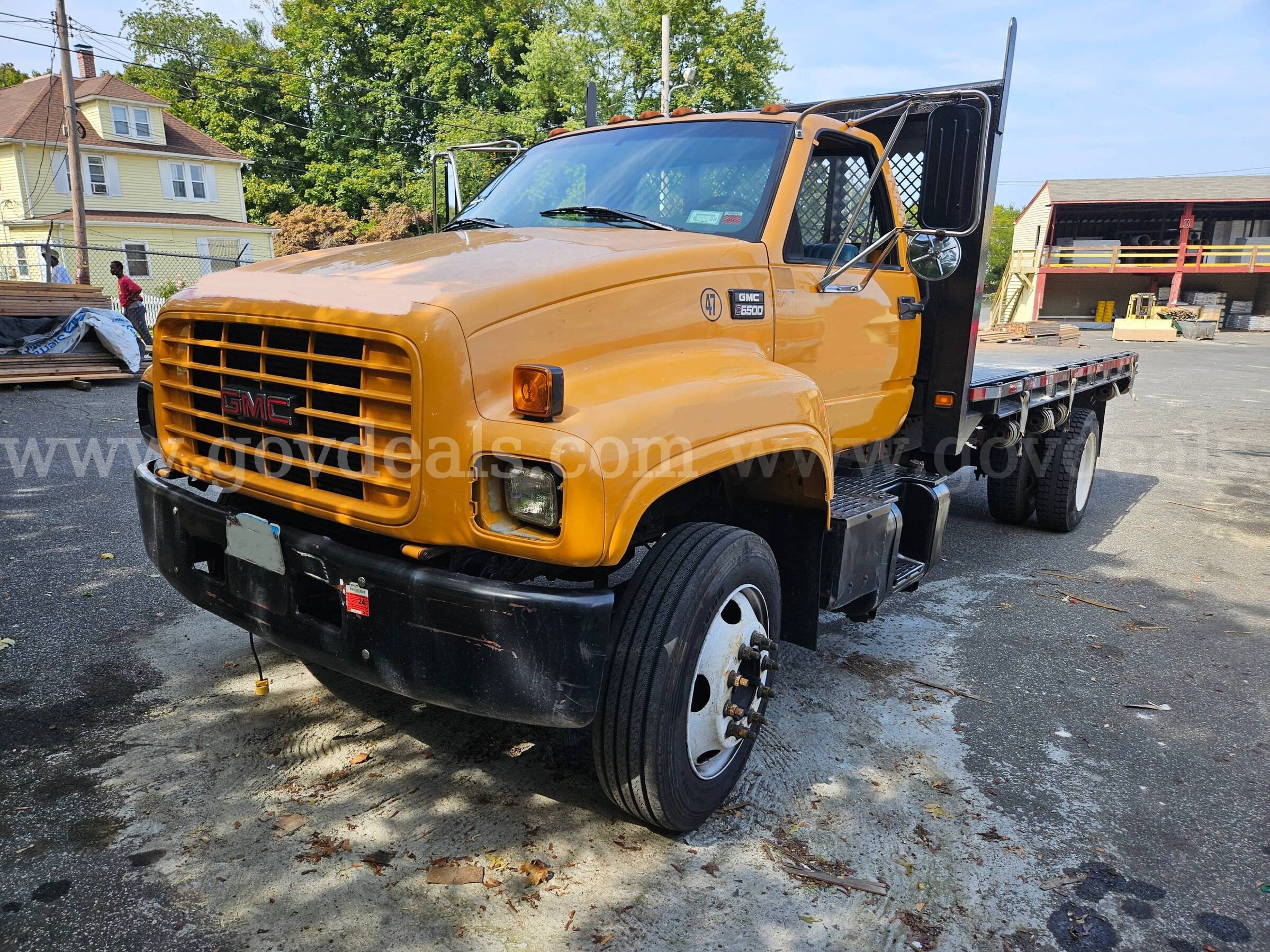 1998 GMC C6500 16FT Flatbed Dump Truck GMC C6500 Government Surplus Auction - Primary Photo
