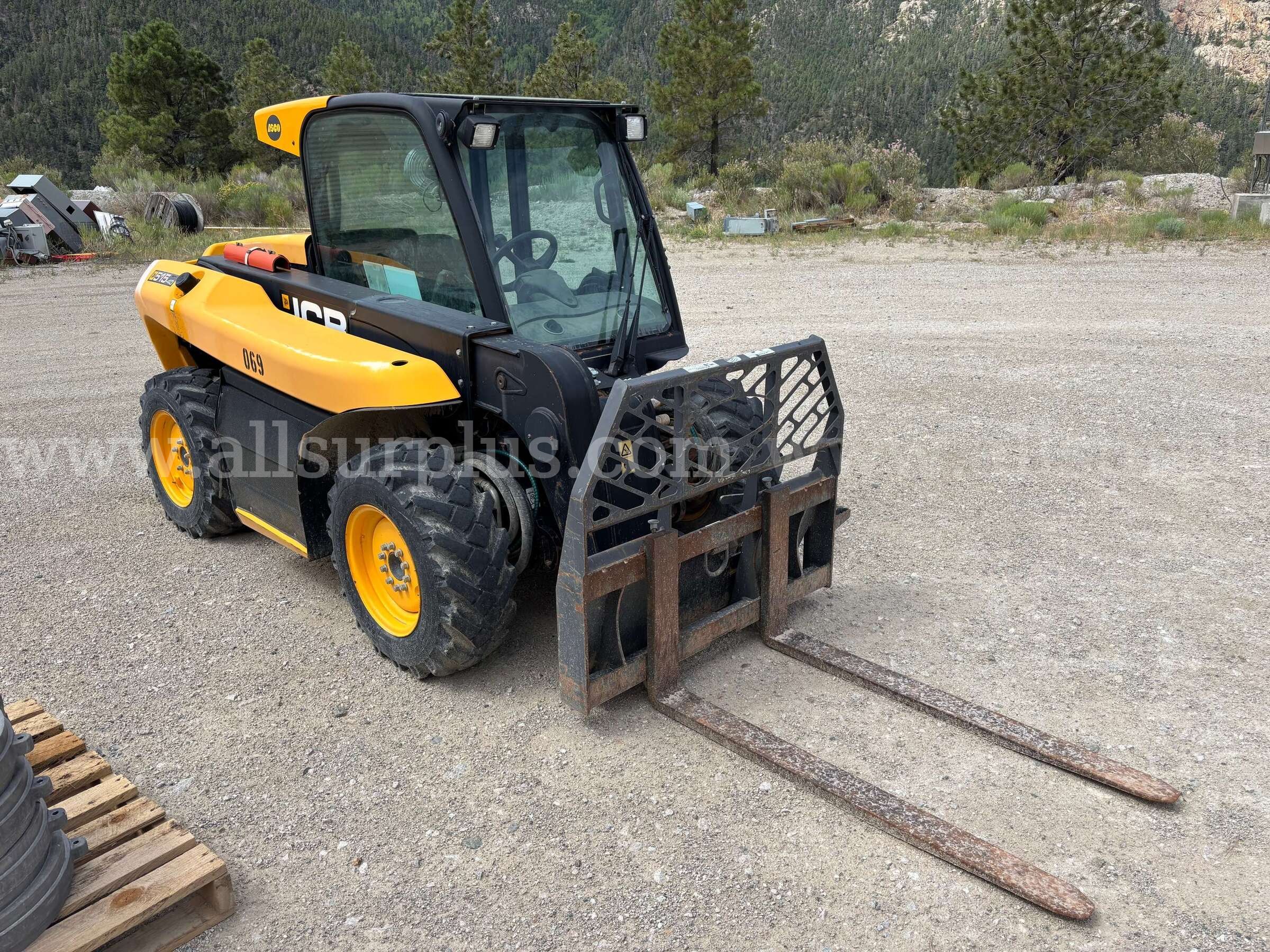 JCB 515-40 compact telehandler, with an enclosed cab, pallet forks.