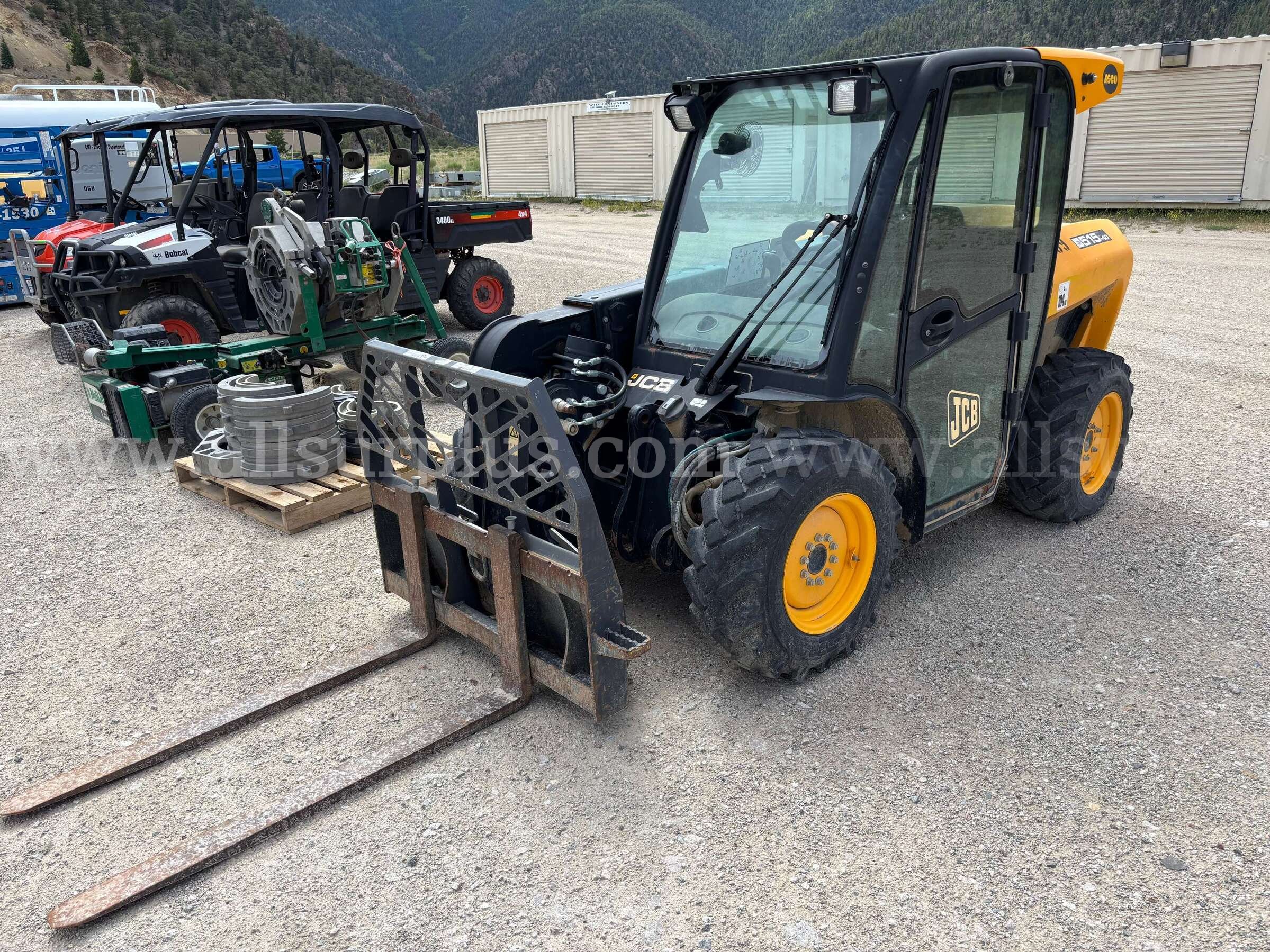 JCB 515-40 compact telehandler, with an enclosed cab, pallet forks. JCB 515 Government Surplus Auction - Photo #2